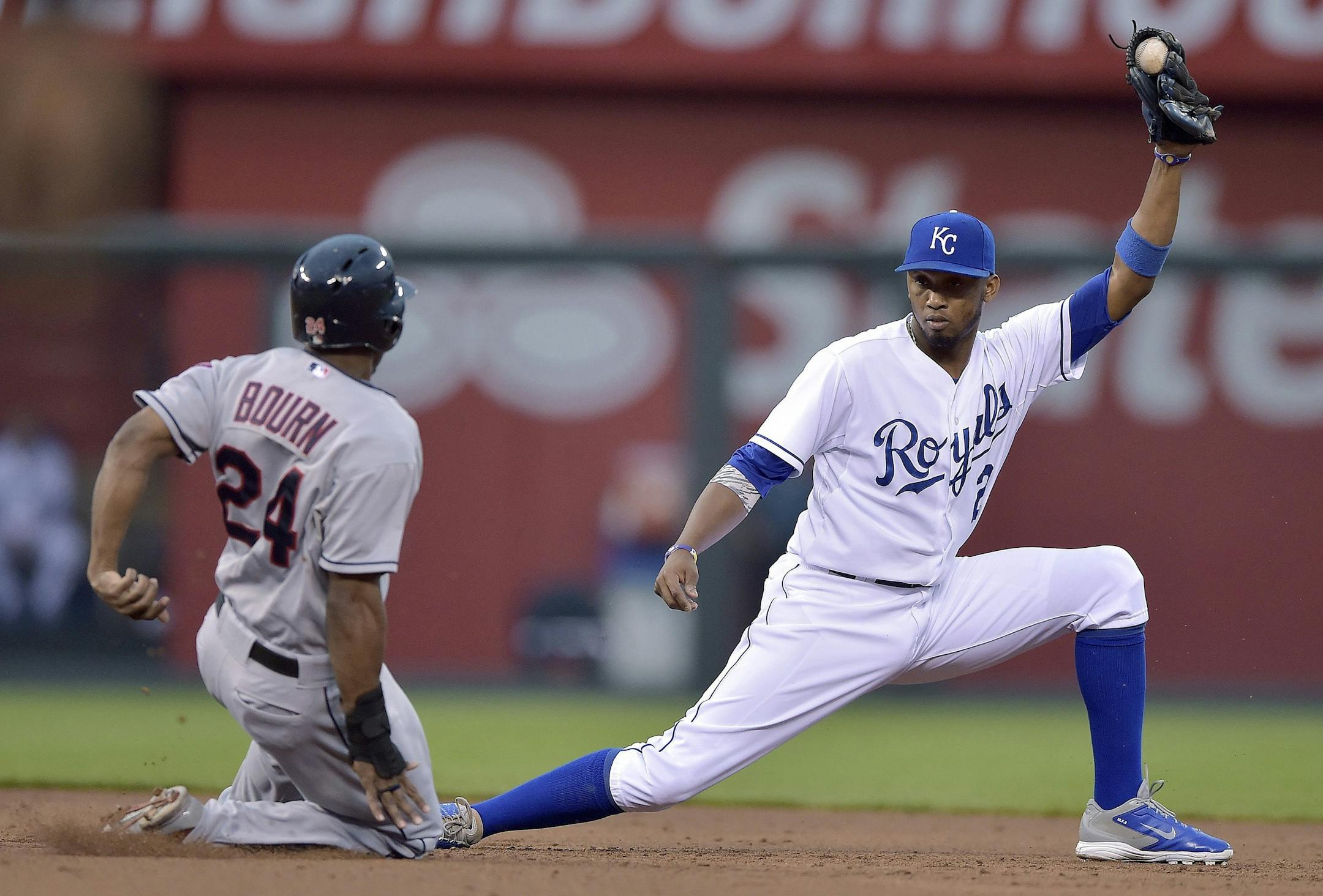 Kansas City Royals shortstop Alcides Escobar (2) catches the throw from right fielder Lorenzo Cain to force Cleveland Indians' Michael Bourn (24) out at second on a single by Asdrubal Cabrera in the third inning during Tuesday's baseball game on June 10, 2014, at Kauffman Stadium in Kansas City, Mo. (John Sleezer/Kansas City Star/MCT) ORG XMIT: 1153874
