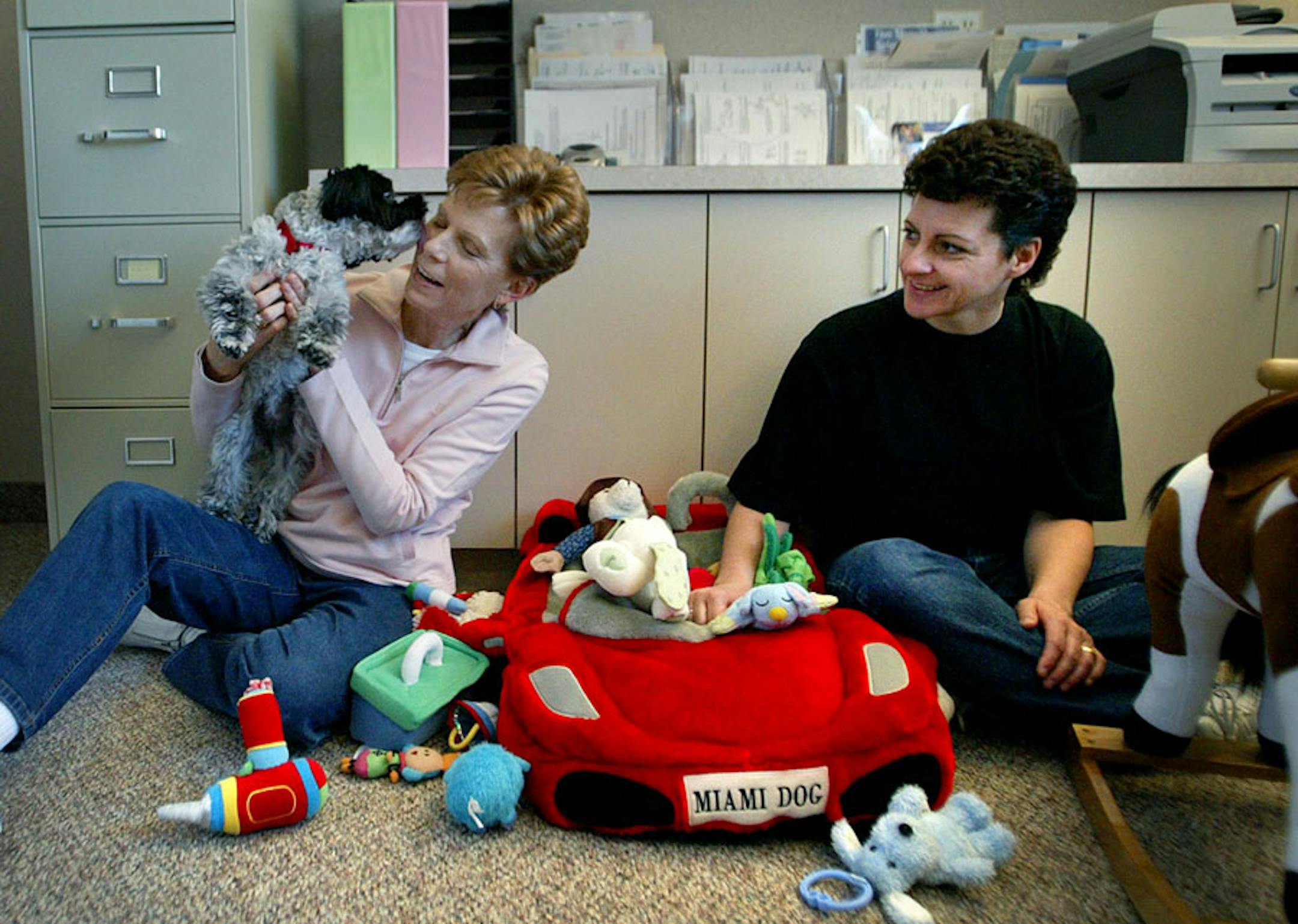 Susan Brendemohl and Tracy Andrews pamper Sasha Goc Radivojevic.