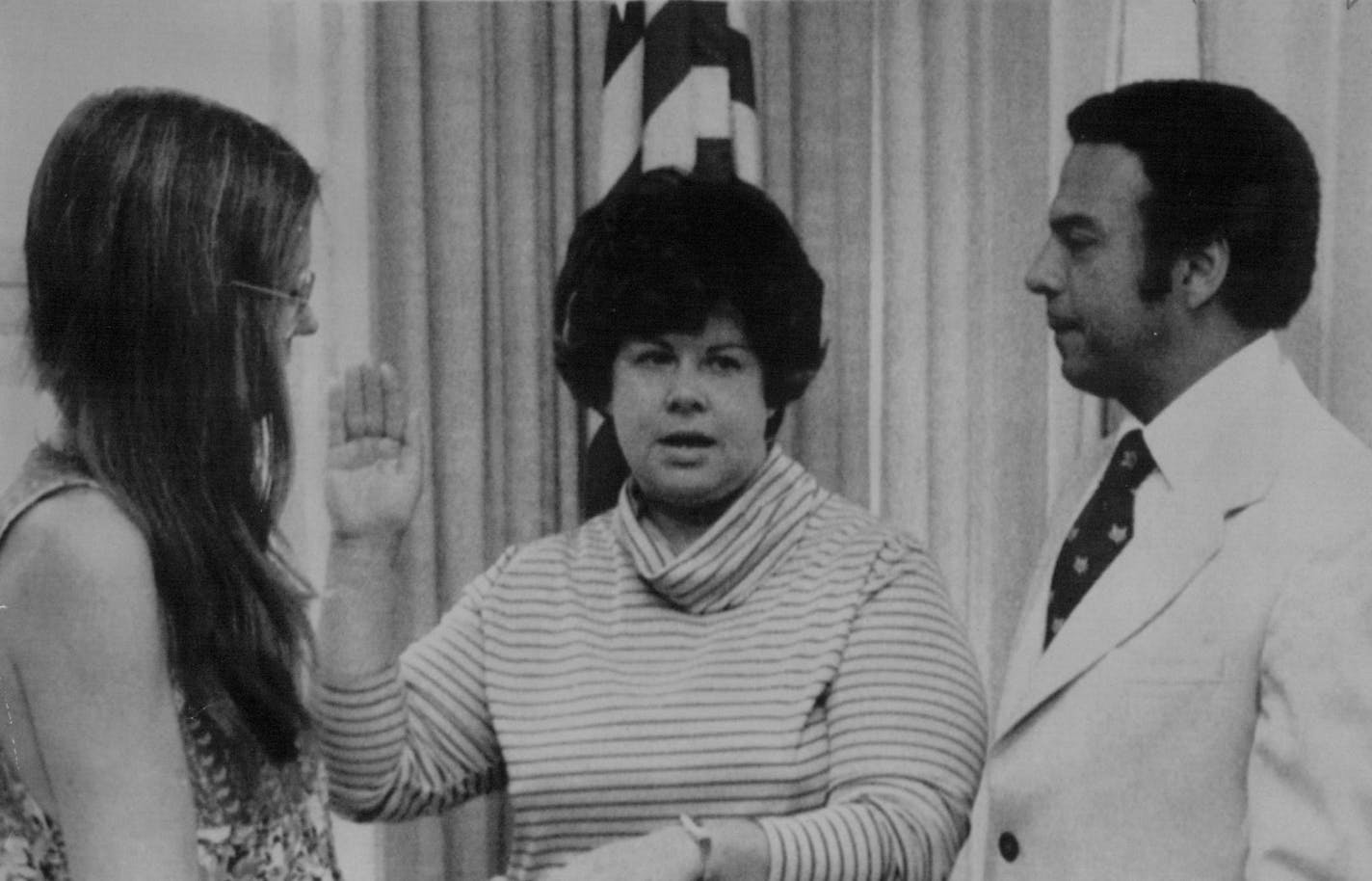 August 13, 1977 Koryne Horbal, Columbia Heights, center, took the oath as representative the Commission on Status of Women of the Social an "Economic Council the United Nations yesterday. Gloria Stelnem, Ms. Magazine editor, held the Bible as U.N.* Ambassador Andrew Young administered the oath at the U.S. mission to the United Nations in New York.