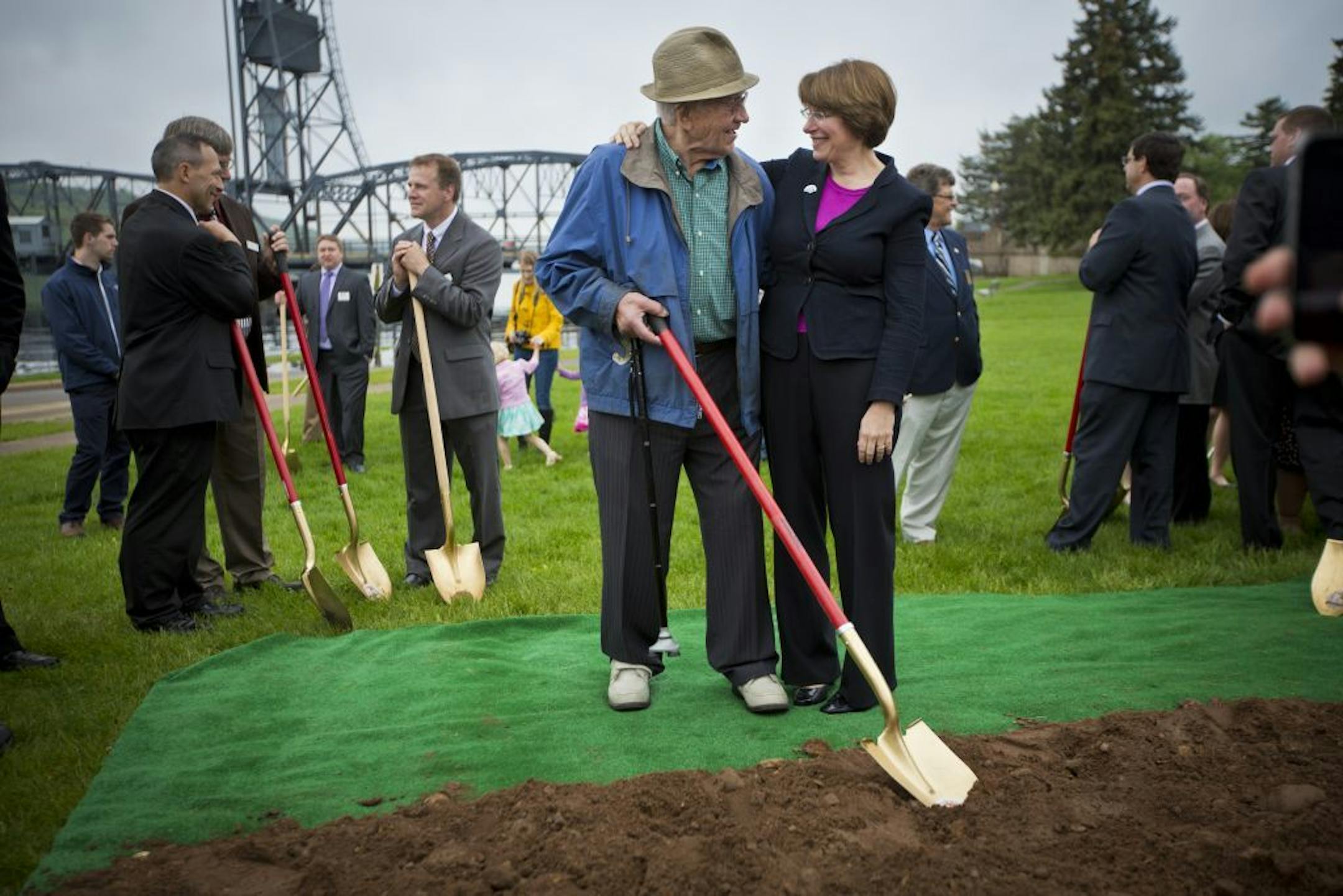 Sen. Amy Klobuchar put her arm around Amos Schultz, 96, who was 15-years-old when the original Stillwater lift-bridge opened. The two were chatting after a ground breaking ceremony for the new St. Croix River bridge (already under way) on Tuesday, May 28, 2013 in Stillwater, Minn.