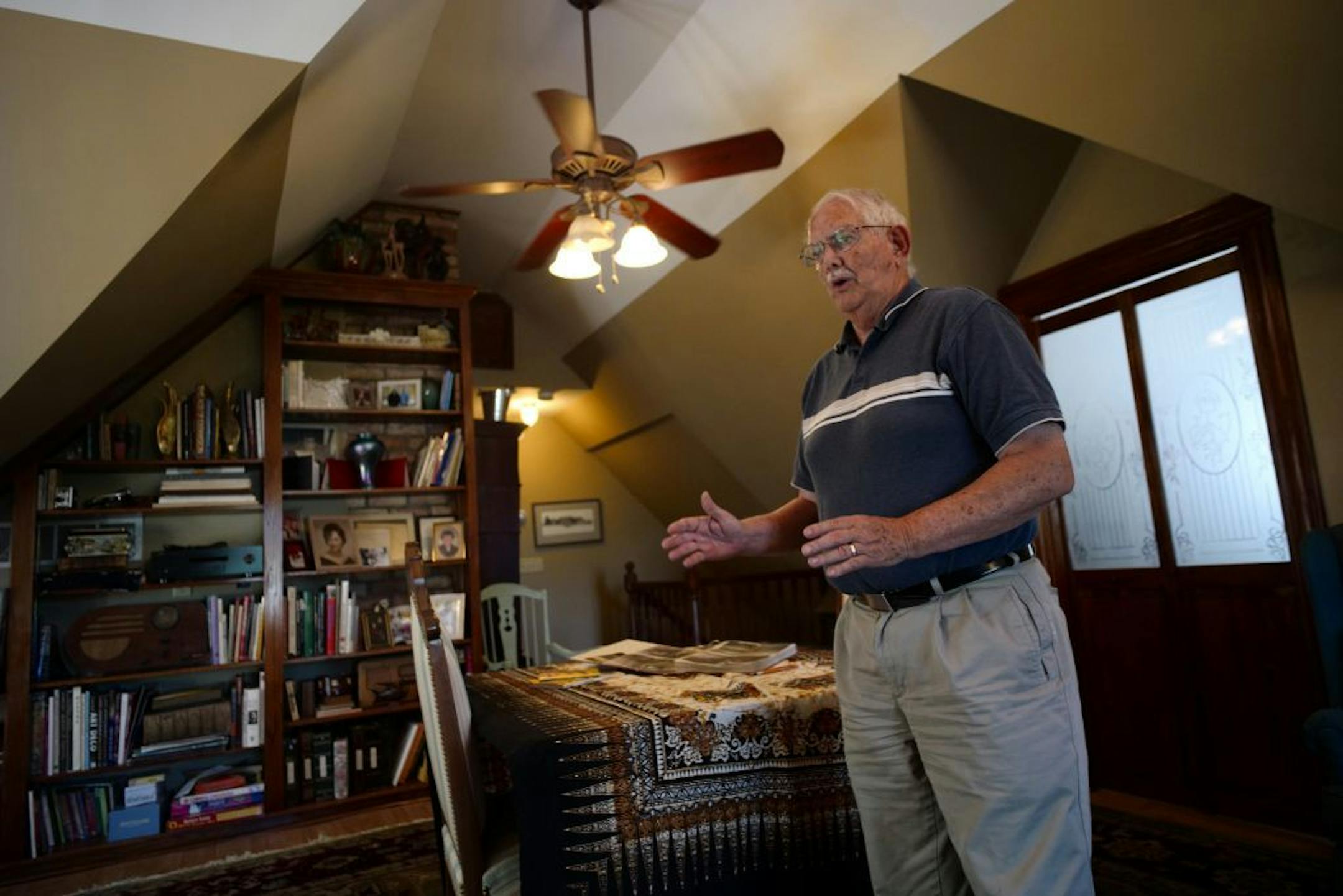 :Craig Pier gained a great room, dining area, guest bedroom and bathroom by finishing off the third-floor walk-up attic in his turn-of-the-century house n Minneapoils.