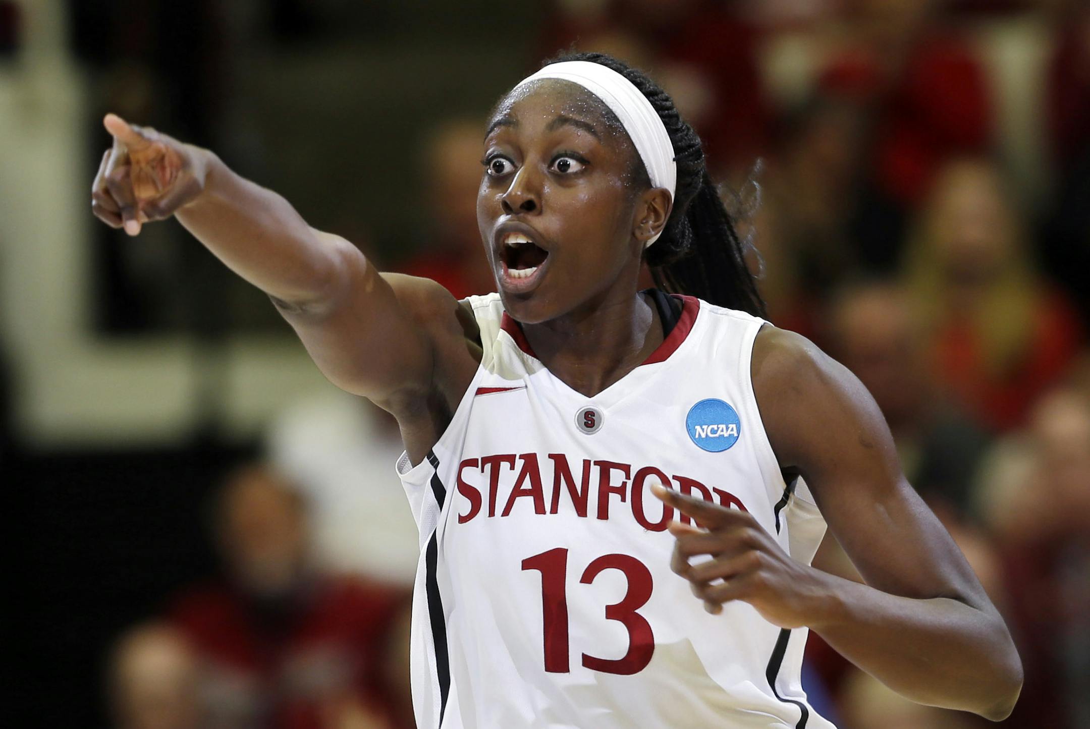 Stanford forward Chiney Ogwumike (13) celebrates after scoring next to Penn State guard Maggie Lucas (33) during a first half of a regional semifinal at the NCAA college basketball tournament in Stanford , Calif., Sunday, March 30, 2014. (AP Photo/Marcio Jose Sanchez)