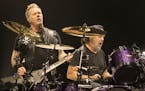 James Hetfield, left, and Lars Ulrich of the band Metallica perform in concert during their "WorldWired Tour" at The Wells Fargo Center on Thursday, O