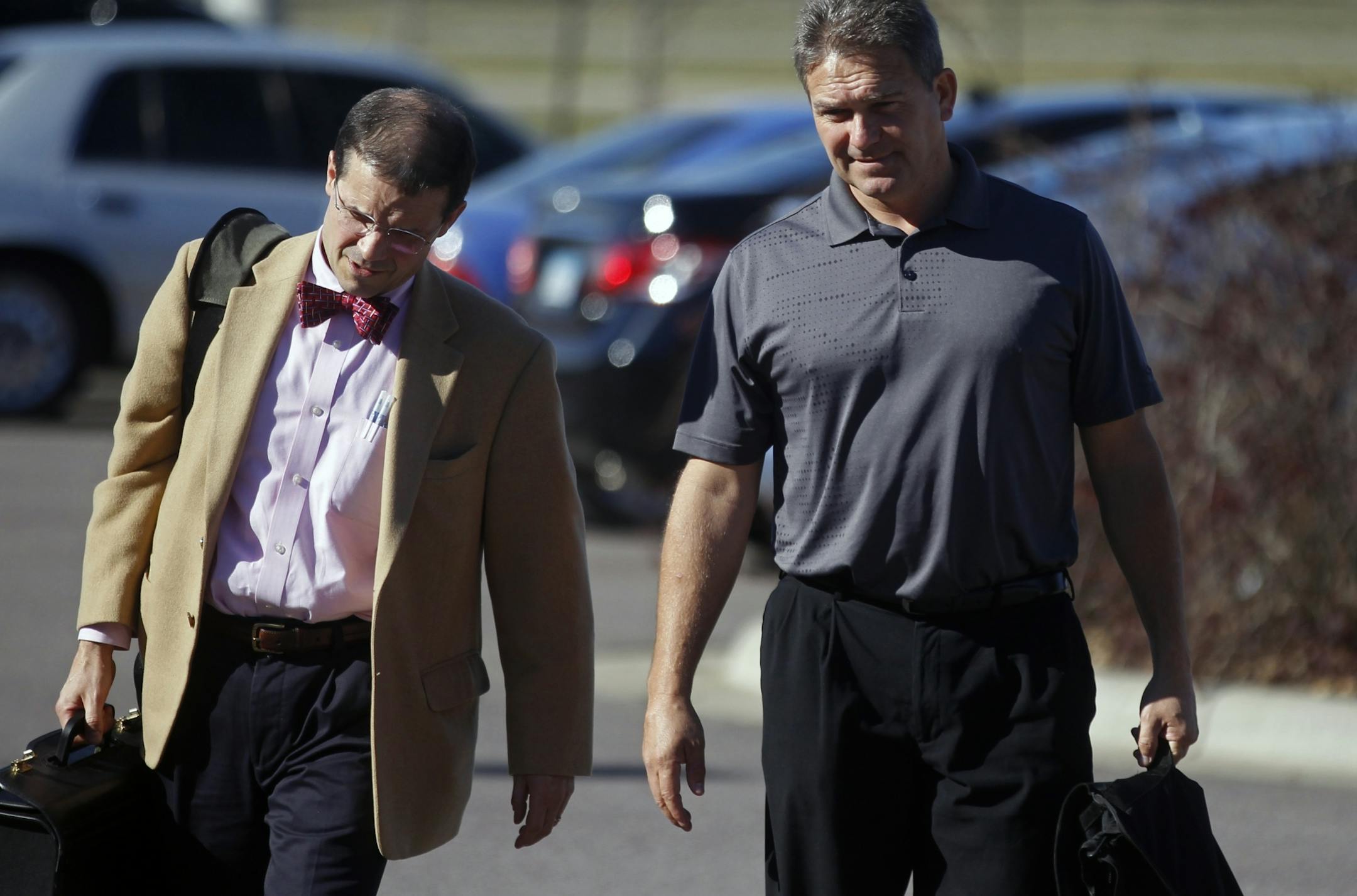 At the Blue Earth County Justice Center, attorney Jim Fleming and Mankato football coach Todd Hoffner, right arrived for an omnibus hearing. The coach was charged in August with 2 felony counts of child pornography for three videos he took of his three kids on his campus-issued cellphone.