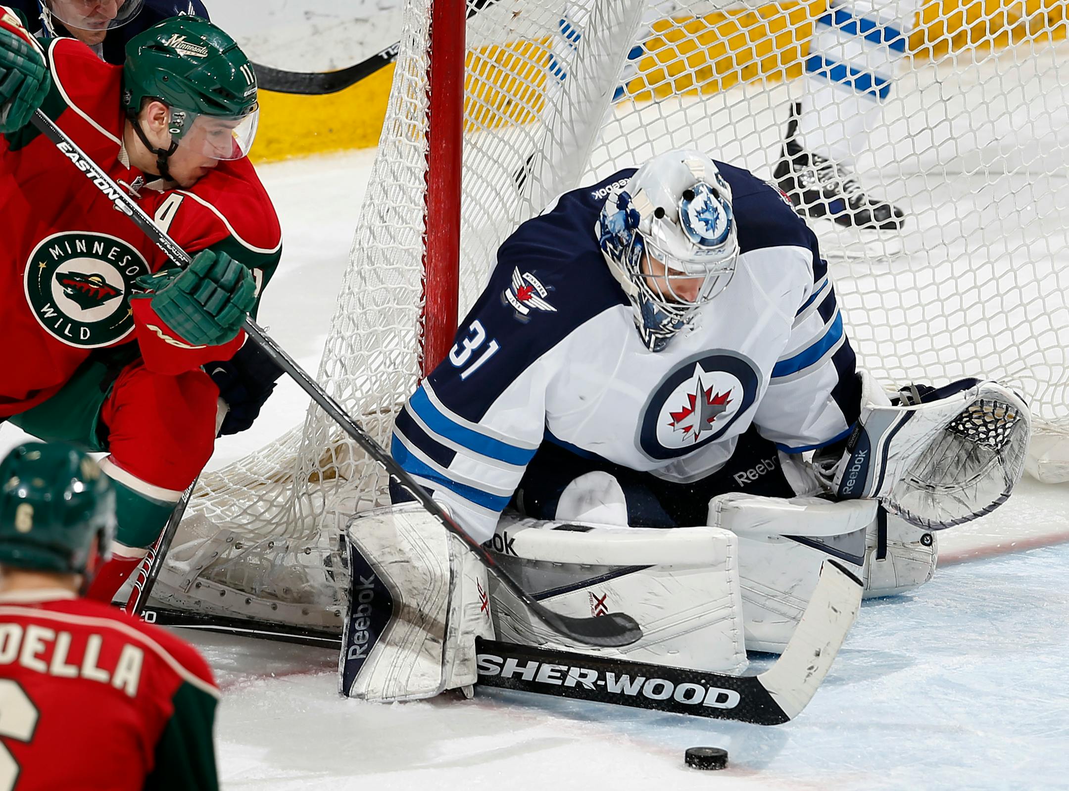 Winnipeg Jets goalie Ondrej Pavelec (31) blocked a shot by Zach Parise (11) in the third period.