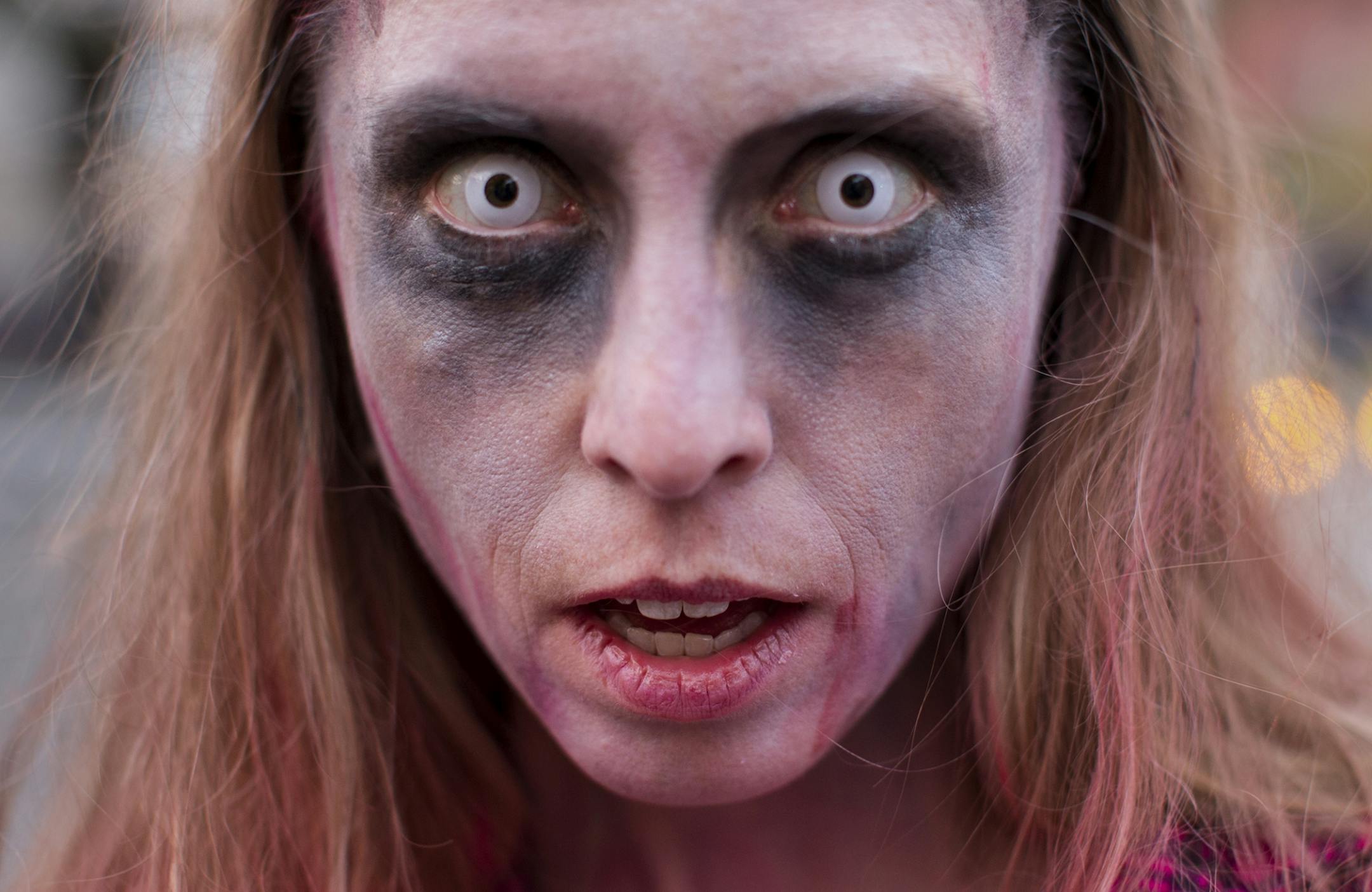 Elizabeth Larsen, 37, of Minneapolis attends the Zombie Pub Crawl in downtown Minneapolis October 12, 2013. The event featured live music, a ferris wheel and food trucks stationed in two parking lots but encouraged zombies to roam the many participating local bars.