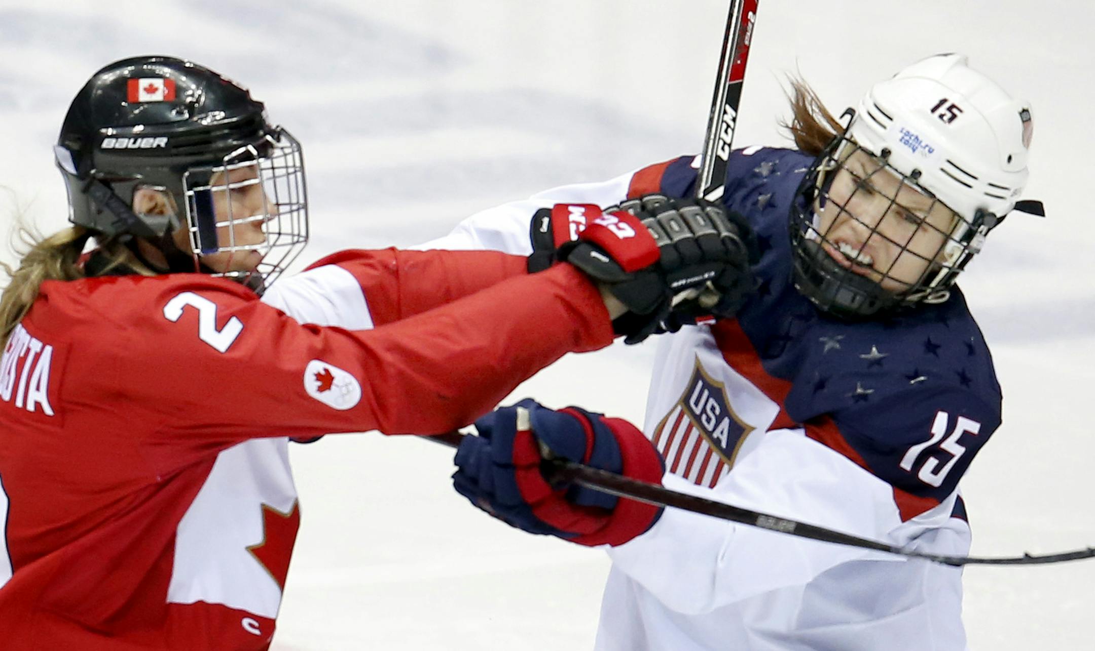 Meghan Agosta (2) and Anne Schleper (15) pushed off of each other in the second period. Team Canada beat Team USA in overtime 3-2 to win the gold medal. ] CARLOS GONZALEZ cgonzalez@startribune.com - February 20, 2013, Sochi, Russia, Sochi 2014 Winter Olympics, Bolshoy Ice Dome, women's hockey gold medal game, USA vs. Canada ORG XMIT: MIN1402201558173687