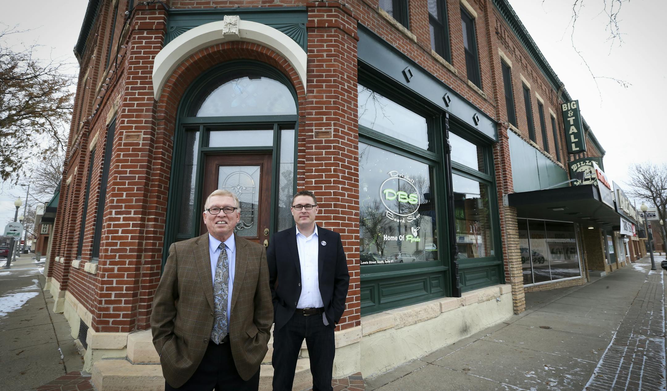 Bill Wermerskirchen and his son Billy Wermerskirchen, right, outside the building that houses Bill's Toggery in Shakopee, Minn., on Tuesday, November 25, 2014. Bill Wermerskirchen, left, will retire this year and his son continue the family business. ] RENEE JONES SCHNEIDER • reneejones@startribune.com