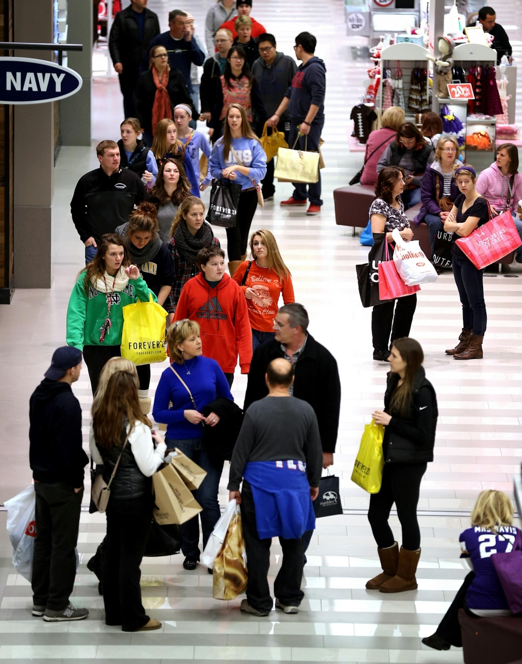Shoppers take advantage of Black Friday deals at Mall of America in Bloomington on Friday, November 28, 2014.