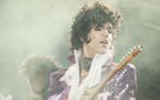 Rock singer Prince performs at the Forum in Inglewood, Calif., during his opening show, Feb. 18, 1985. (AP Photo/Liu Heung Shing) ORG XMIT: APHS381653