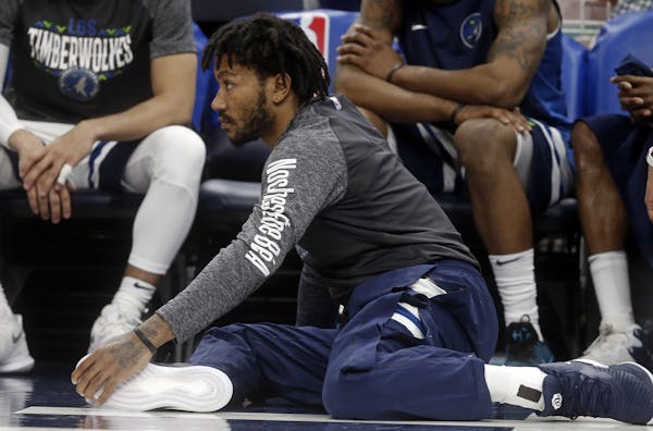 Newly signed Wolves guard Derrick Rose sat on the floor but didn't get onto the floor for a minute of playing time in his first game with the Wolves, 