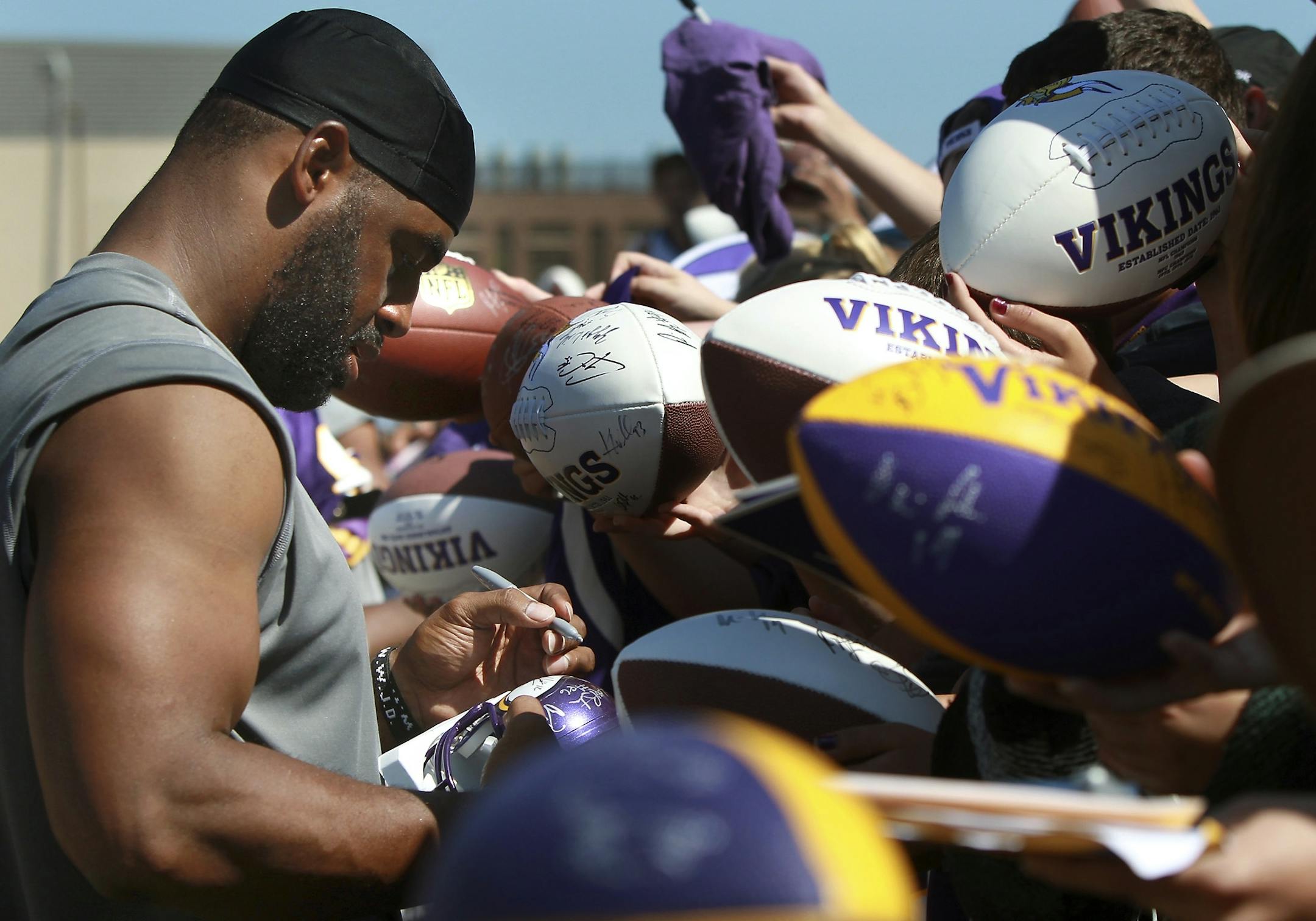 Minnesota Vikings quarterback Donovan McNabb was surrounded by a sea of footballs as he signed autographs for fans on the last day of practice that was open to the public, Thursday, August 11, 2011 in Mankato, MN.
