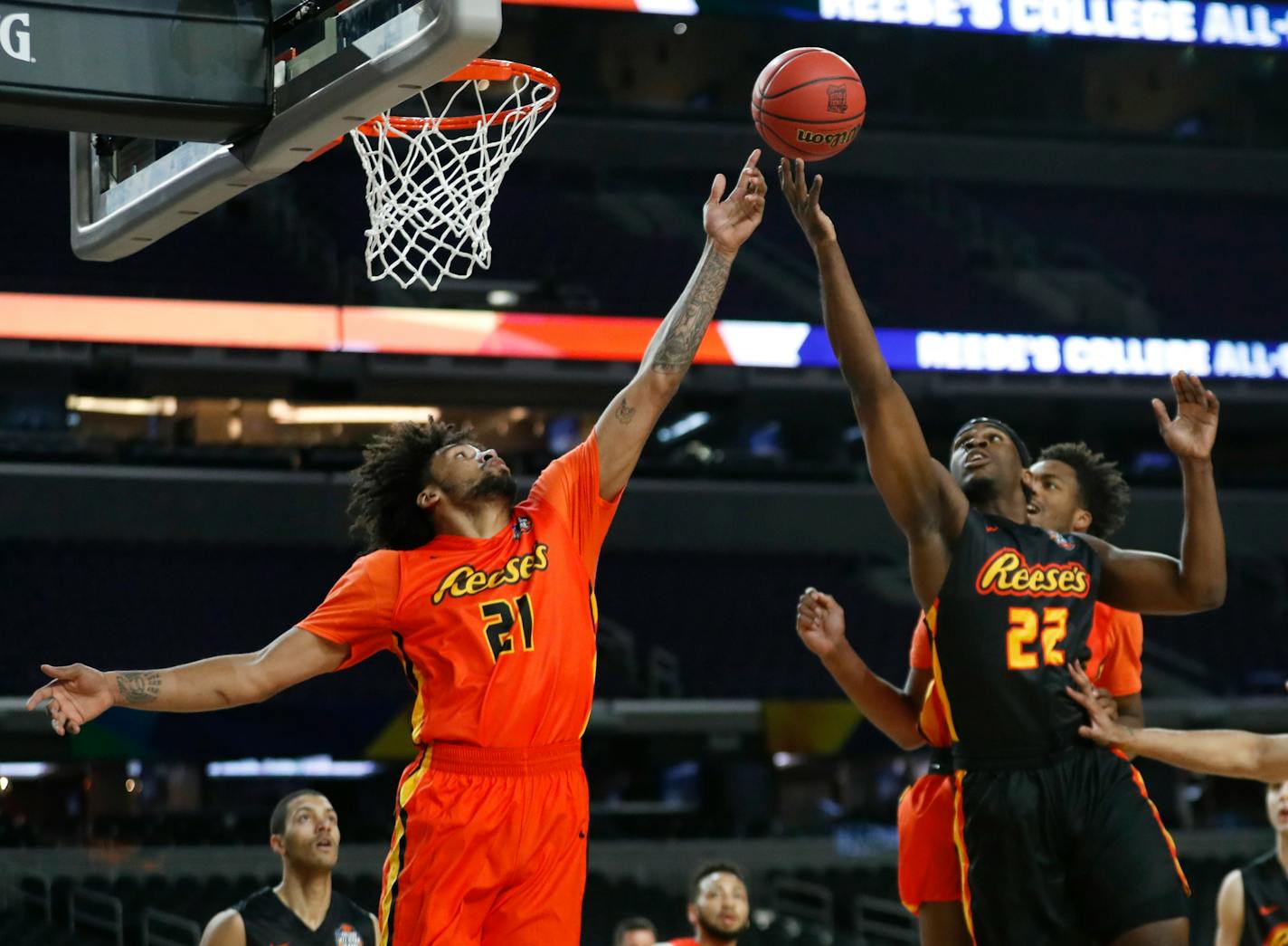 Jordan Murphy (21) fights for a rebound with College of Charleston's Jarrell Brantley (22) during the College All-Star Game at the Final Four