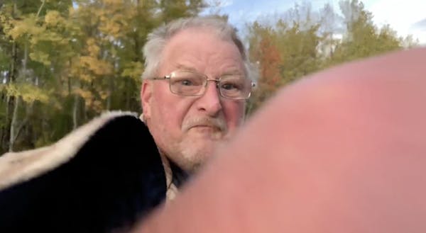 WCCO-TV photojournalist Dymanh Chhoun took video of a man, seen here, confronting a group of Joe Biden supporters gathered near Duluth's airport.