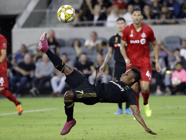 Los Angeles FC's Latif Blessing shoots on a bicycle kick against Toronto FC during the second half of their match Sept. 21 in Los Angeles. The teams p