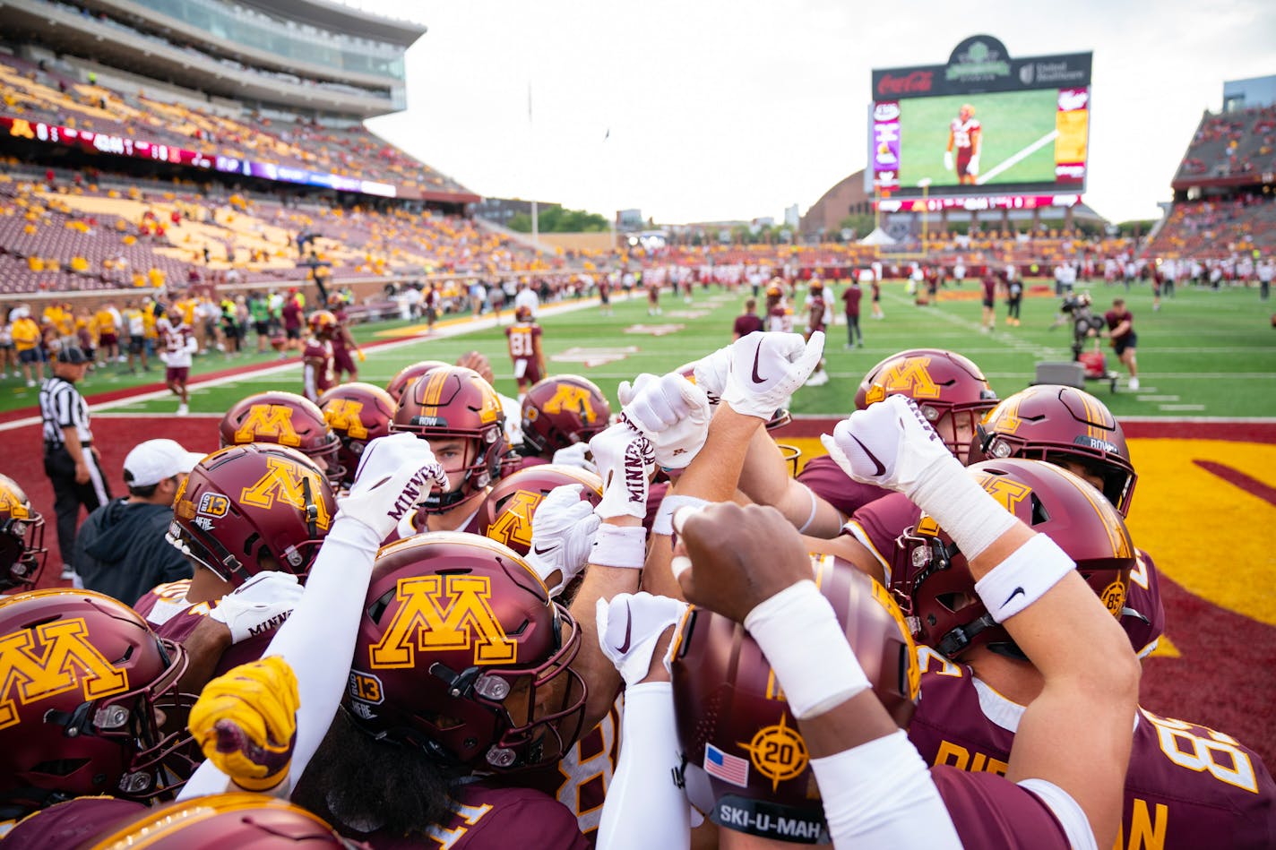 Minnesota Gophers players huddle up before beginning warmups ahead of the season opener against Nebraska Thursday, Aug. 31, 2023, at Huntington Bank Stadium in Minneapolis, Minn. ]