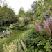 Ellen Akins tends an expansive garden in Cornucopia, Wis.