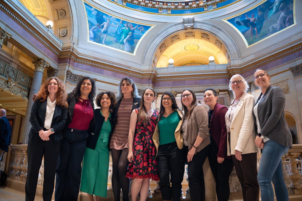 Democratic Rep. Zooey Zephyr, center, posed for a photo with the Queer Caucus, including Rep. Leigh Finke. Zephyr, the first openly transgender woman elected to the Montana Legislature, was voted off that state’s House floor for violating its rules of decorum.