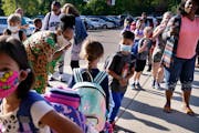 New Hoover Elementary School principal Keisha Davis greeted students and parents outside the school before the start of the school day on the first da