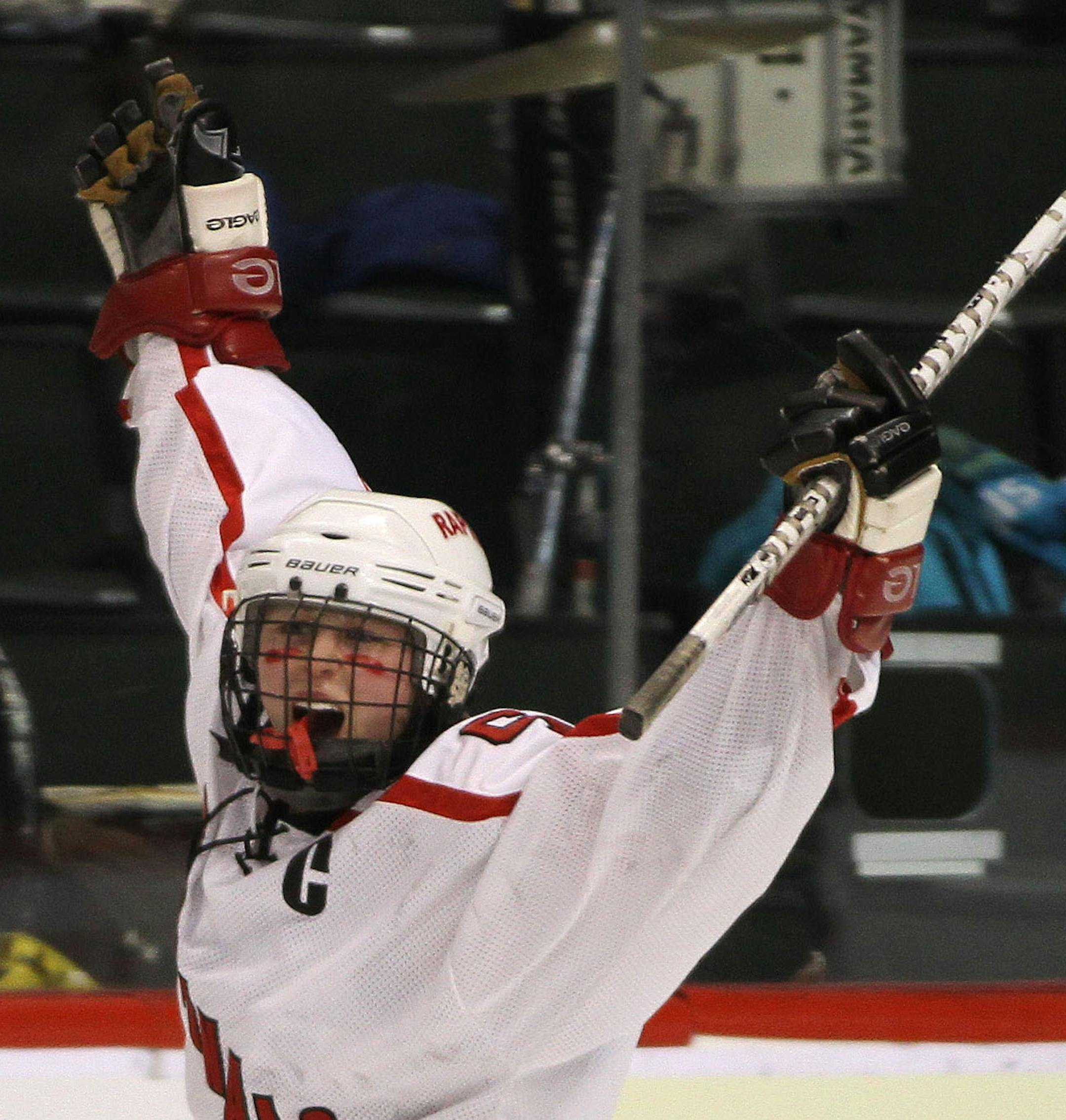 BRUCE BISPING ‚Ä¢ bbisping@startribune.com St. Paul, MN., Thursday, 2/24/11] Coon Rapids vs North Wright County. (left to right) Coon Rapids Rachael Bona celebrated her first goal against North Wright County.