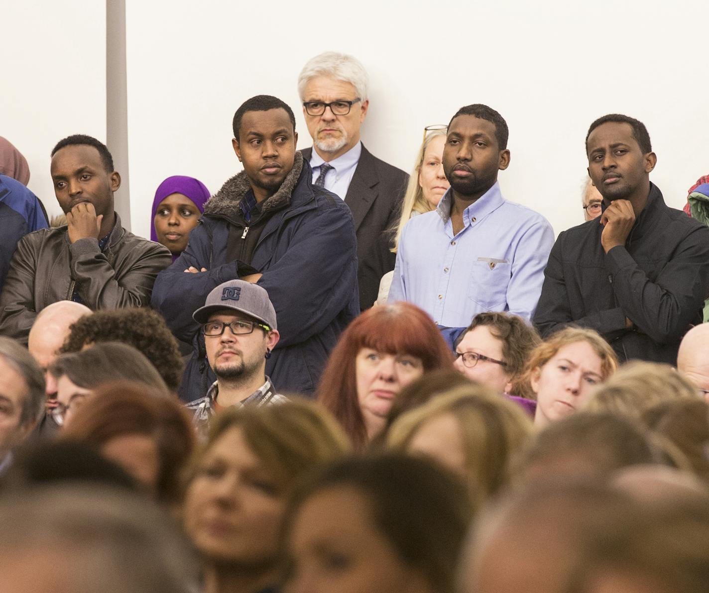 engaged: At top, Hafsa Abdi, a senior at Technical High School in St. Cloud, participated in a packed forum last week about the Muslim experience in Minnesota.