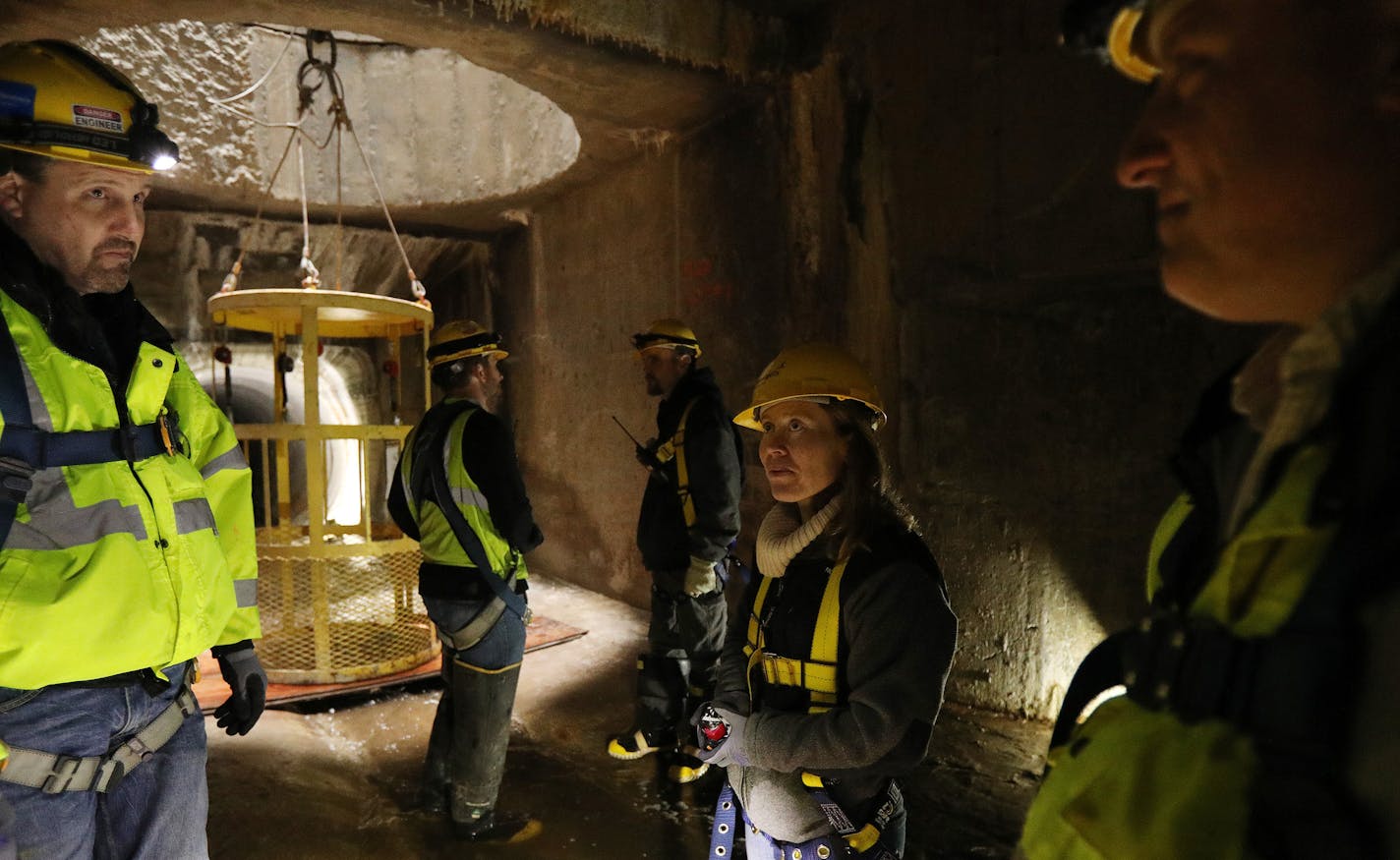 Katrina Kessler, center, director of surface water and sewers for Minneapolis Public Works, talked with engineers Kevin Danen, left, and Joe Klejwa on a recent tour.