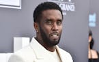 Sean "Diddy" Combs, seen in 2022, was sued Monday by a music producer who accused the music mogul of sexually assaulting him and forcing him to have s