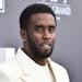 Sean "Diddy" Combs, seen in 2022, was sued Monday by a music producer who accused the music mogul of sexually assaulting him and forcing him to have s