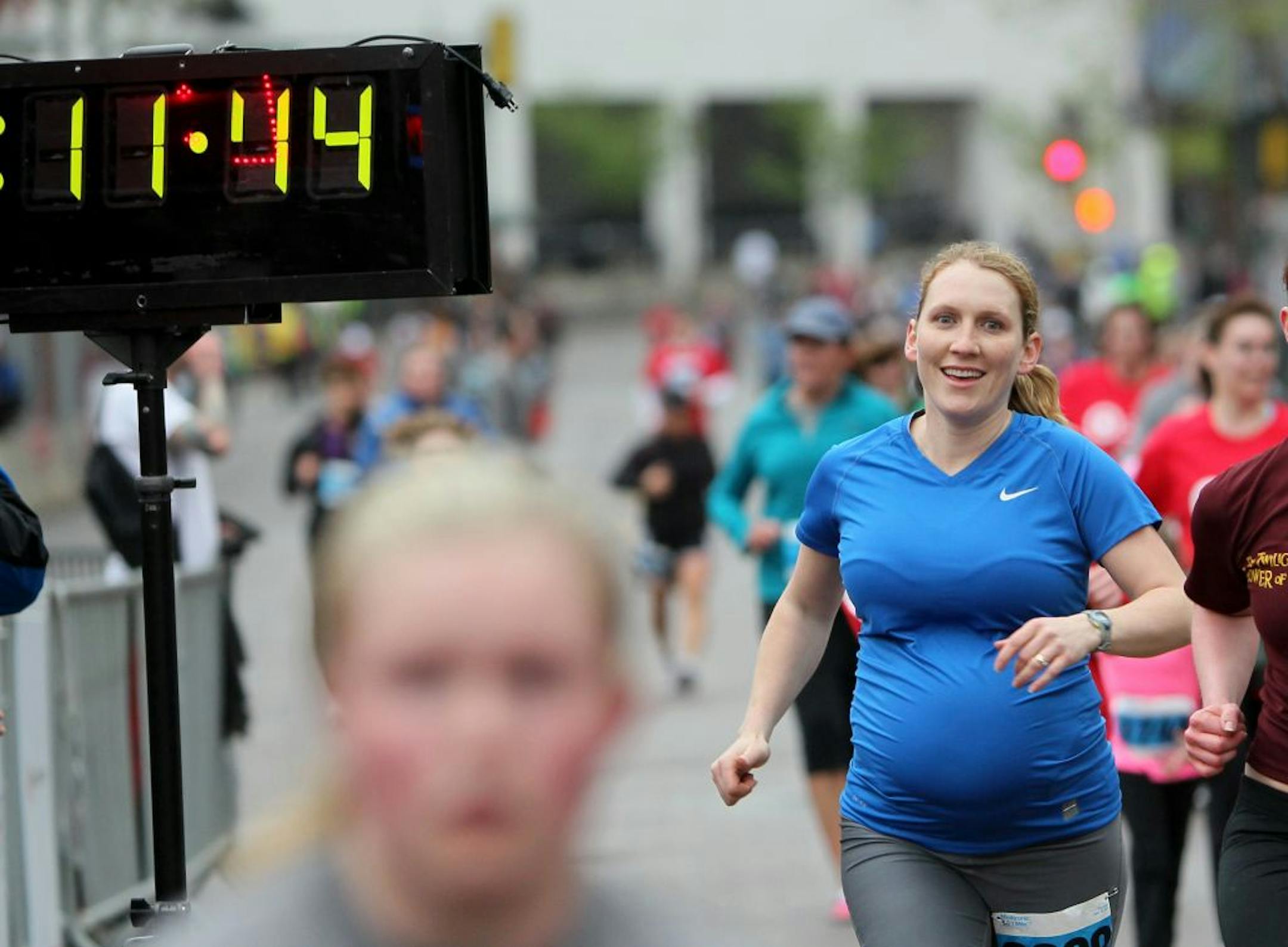 A nine-months-pregnant Sarah Linder-Stenzel crossed the finish line of the Medtronic TC Mile on May 12 in downtown Minneapolis.