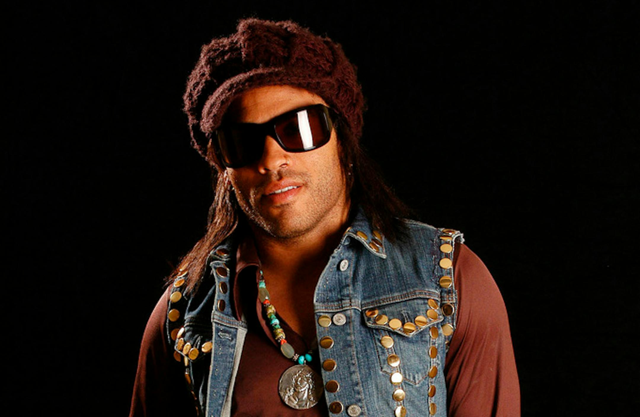 FILE - Lenny Kravitz appears during a portrait session in New York on May 20, 2004. In a new memoir, "Let Love Rule," Kravitz explores his childhood and ends with him on the verge of stardom and deeply in love with actress Lisa Bonet. (AP Photo/Jim Cooper, File)