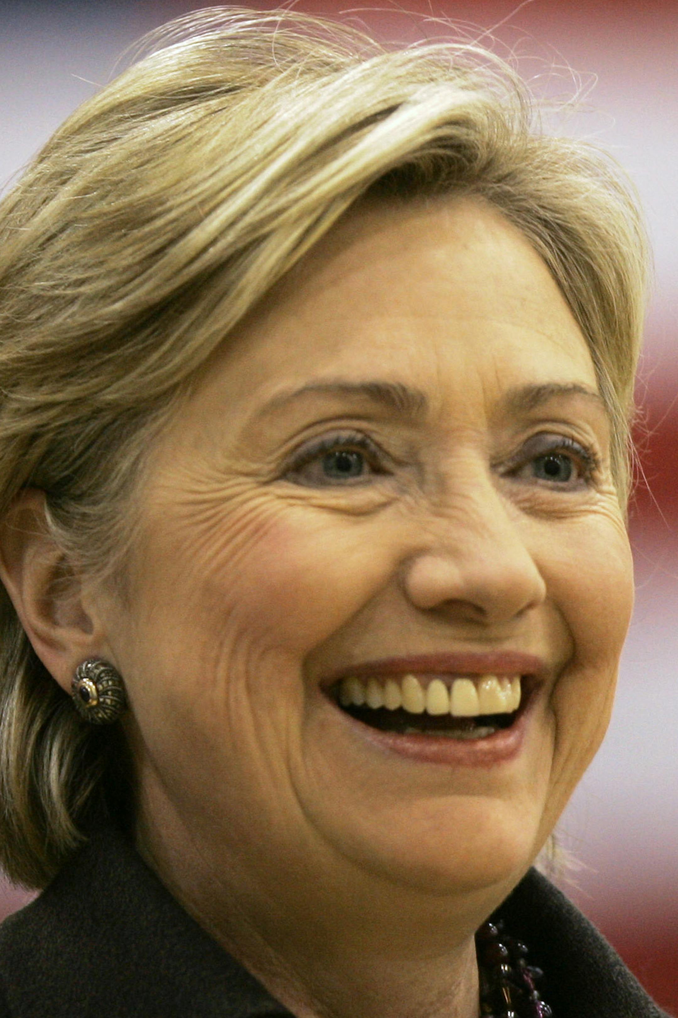 FILE - In this Dec. 31, 2007, file photo, then-Democratic presidential hopeful Sen. Hillary Rodham Clinton, D-N.Y., smiles while speaking at a campaign stop at Muscatine West Middle School in Muscatine, Iowa. Clinton last left Iowa on an ìexcruciatingî night, the beginning of the end of her White House campaign. She returns for the first time this weekend, not quite yet running for president, but sure to hear cheers from a crowd of Democrats hoping she will. (AP Photo/Jeff Chiu, File)