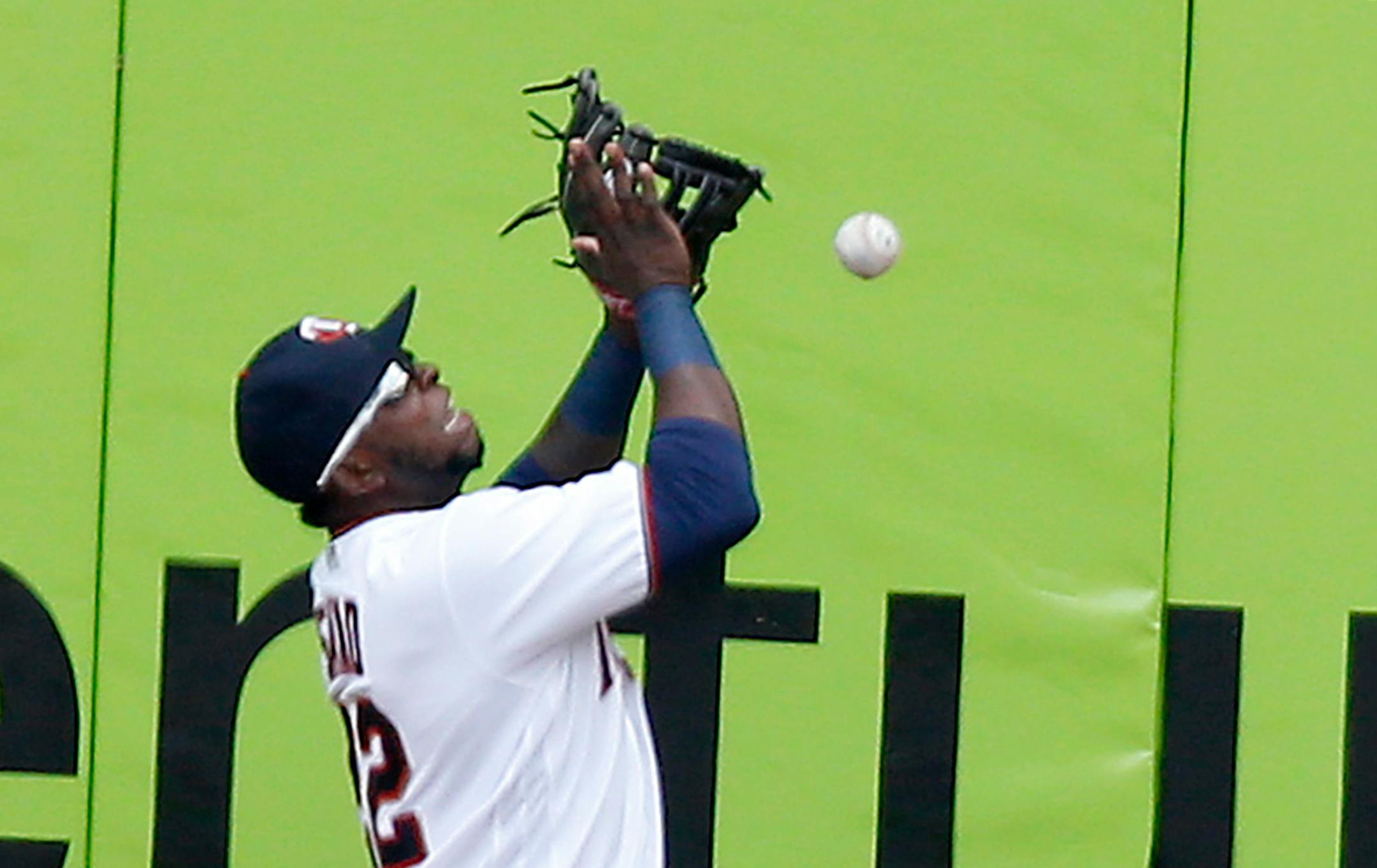 Minnesota Twins right fielder Miguel Sano attempted to field the ball off the wall on a double by Scooter Gennett in the first inning.