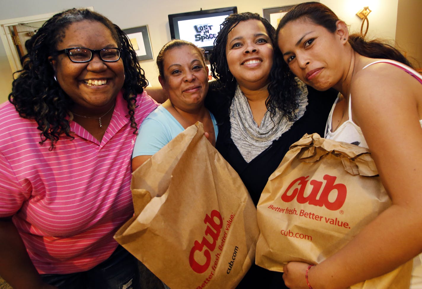 Program director Jennifer Dodd, grocery recipient Isabel Sanchez, executive director Jia Brown and gorcery recipient Janet Gasga. ] The Summer Loaves program at Christ Church in Apple Valley provides free lunches to parents and their children as well as providing other food supplies, clothing, books and games. (MARLIN LEVISON/STARTRIBUNE(mlevison@startribune.com)