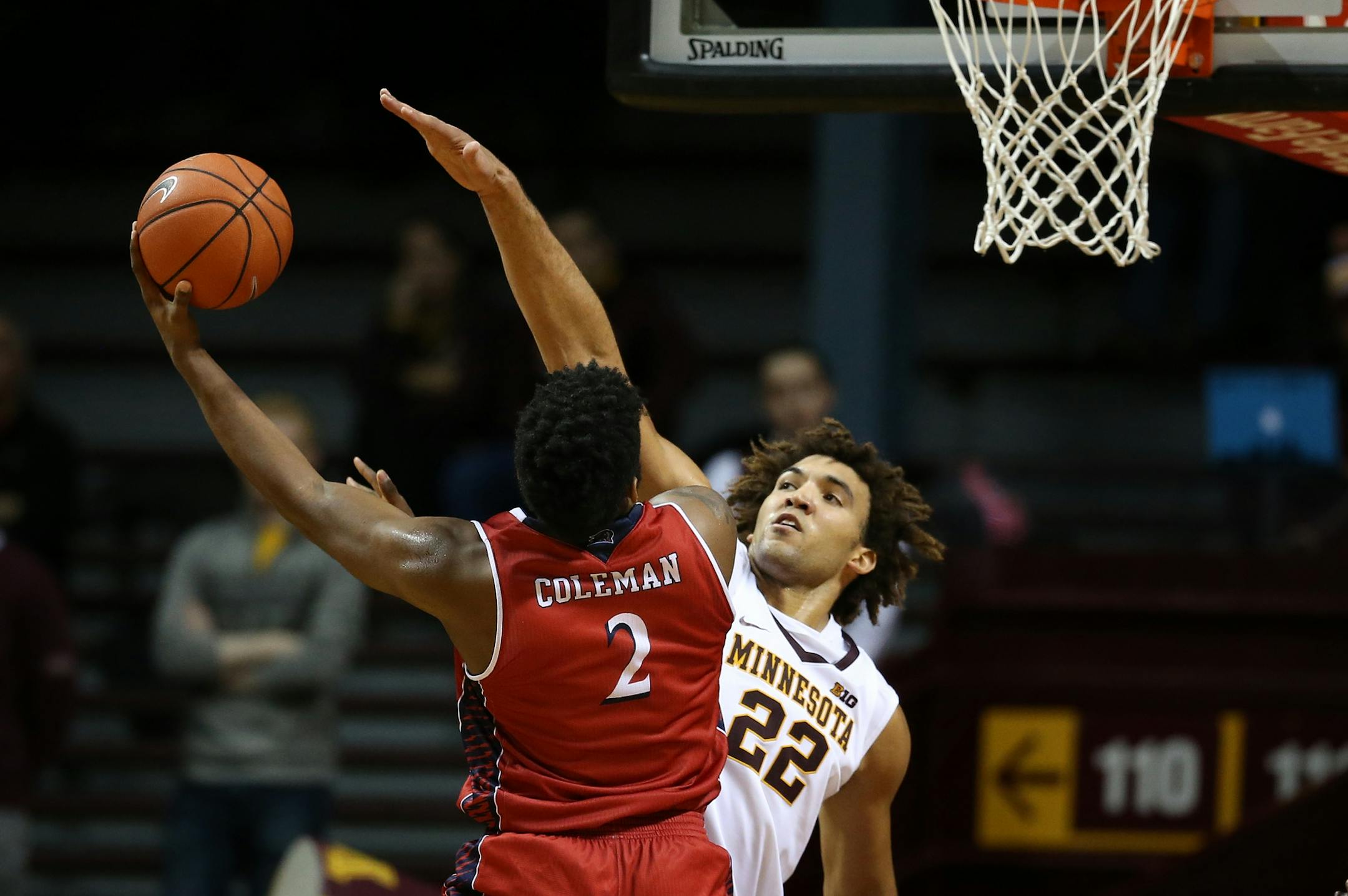Minnesota Golden Gophers center Reggie Lynch (22) stopped a shot attempt by N.J.I.T Highlanders guard Tim Coleman (2) at Williams Arena December 06,2016 in Minneapolis , MN.