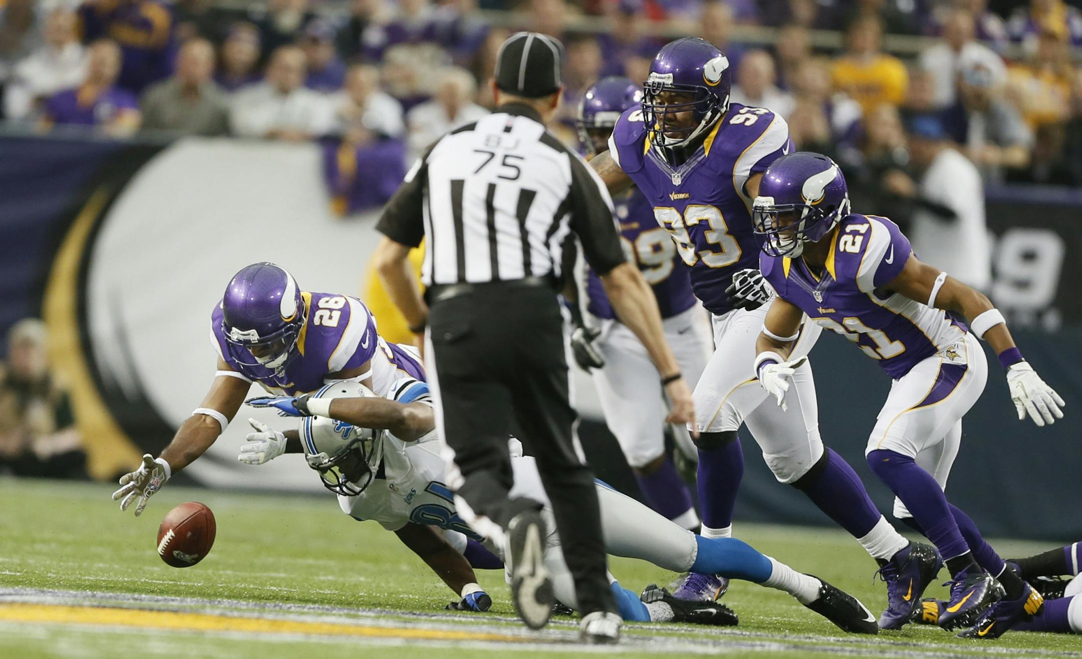 Vikings cornerback Antoine Winfield (26) recovered a fumble by Lions receiver Calvin Johnson in the fourth quarter Sunday.