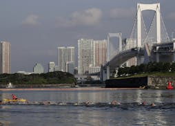 Athletes compete in a marathon swimming test event at Odaiba Marine Park, a venue for marathon swimming and triathlon at the Tokyo 2020 Olympics, Sund