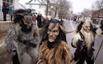 Members of the Minnesota Krampus organization stood along the parade route heckling the other floats before marching themselves in Saturday's Winter C
