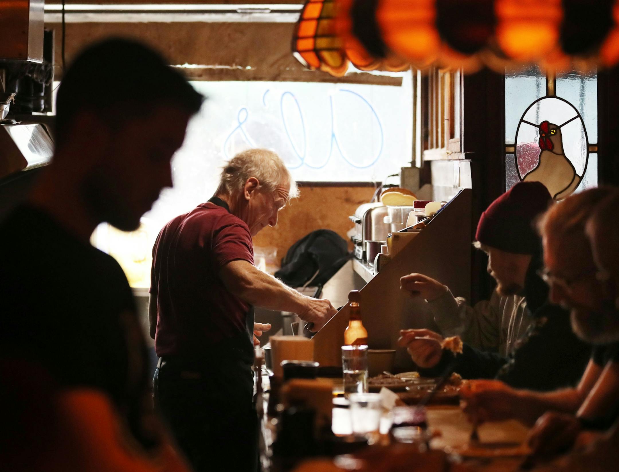 Doug Grina, a staple character at Al's Breakfast for 42 years, works behind the counter on Wednesday, Dec. 18, 2019.