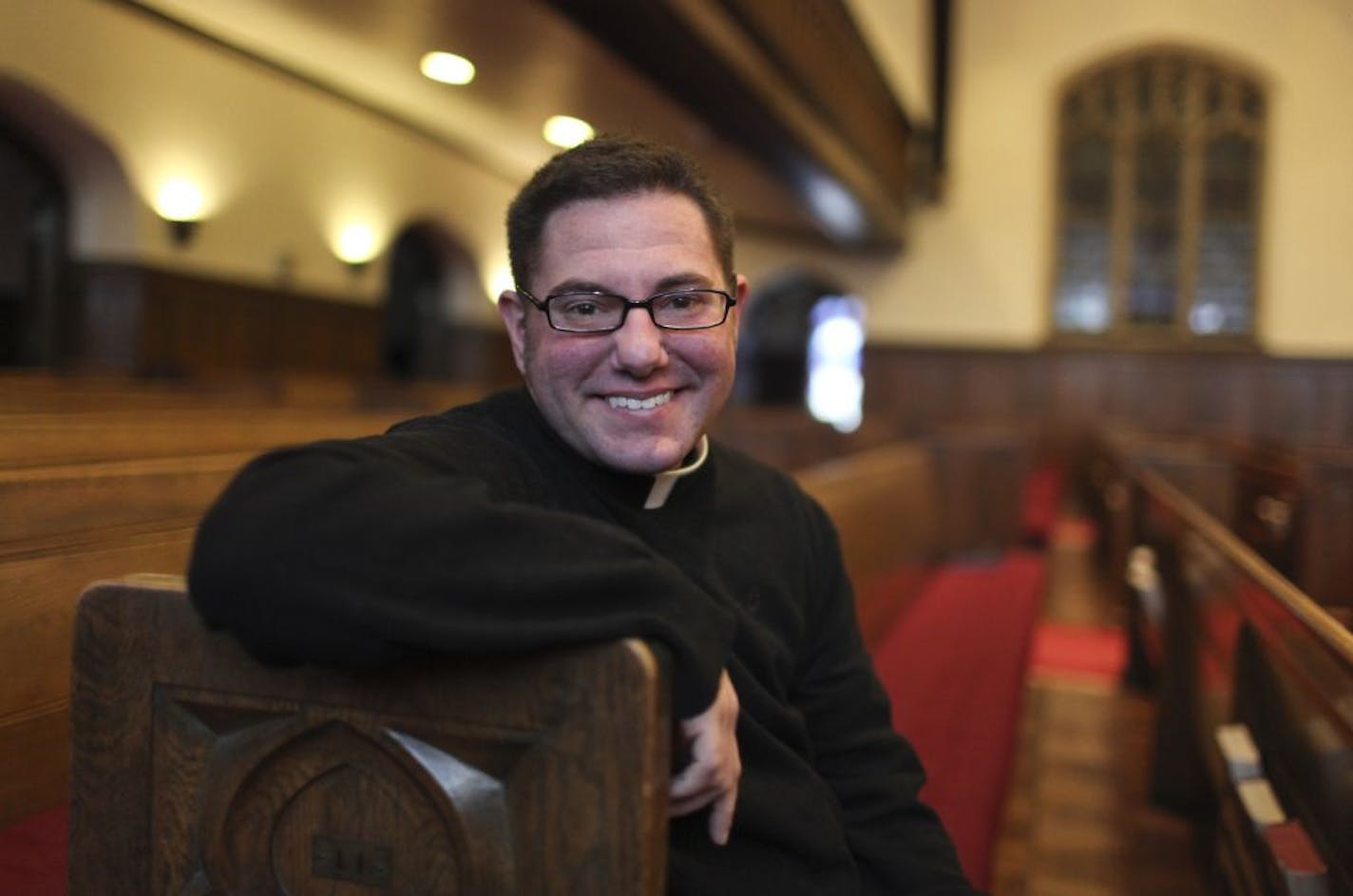 Soon-to-be North American Old Catholic Church denomination priest Shannon Kearns, 32, posed inside the main sancuary of Plymouth Congregational Church, Thursday, Jan. 17, 2013, in Minneapolis, MN.