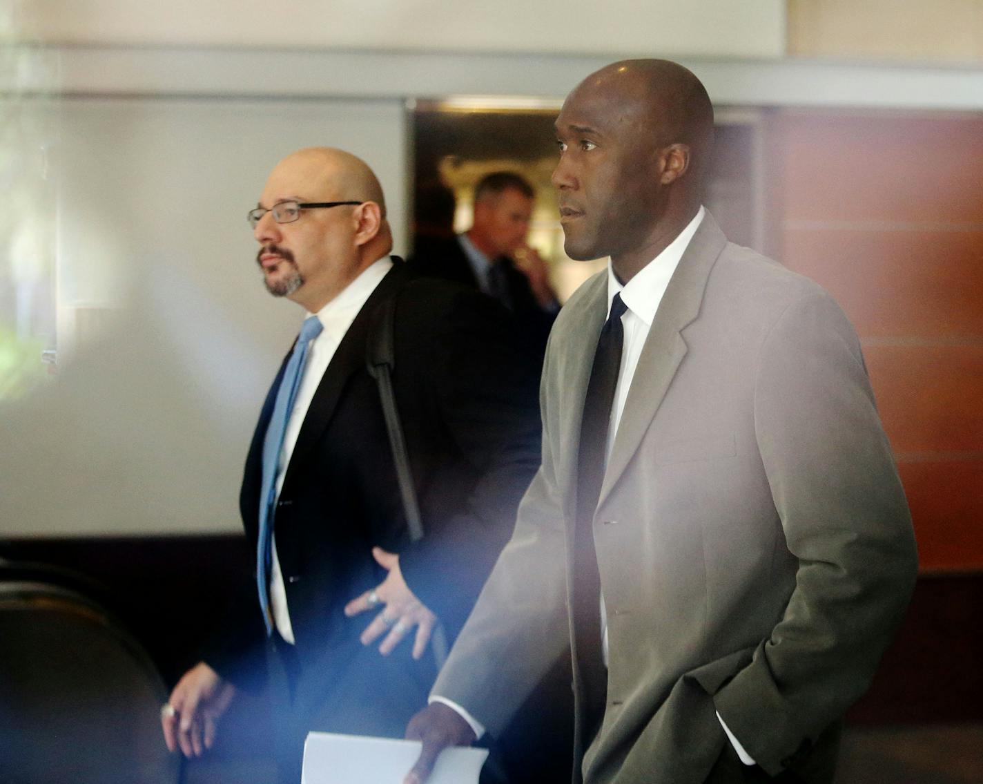 Minneapolis police officer Michael Griffin, right, was accompanied by his attorney, Ryan Kaess, as he left court in May 2015.