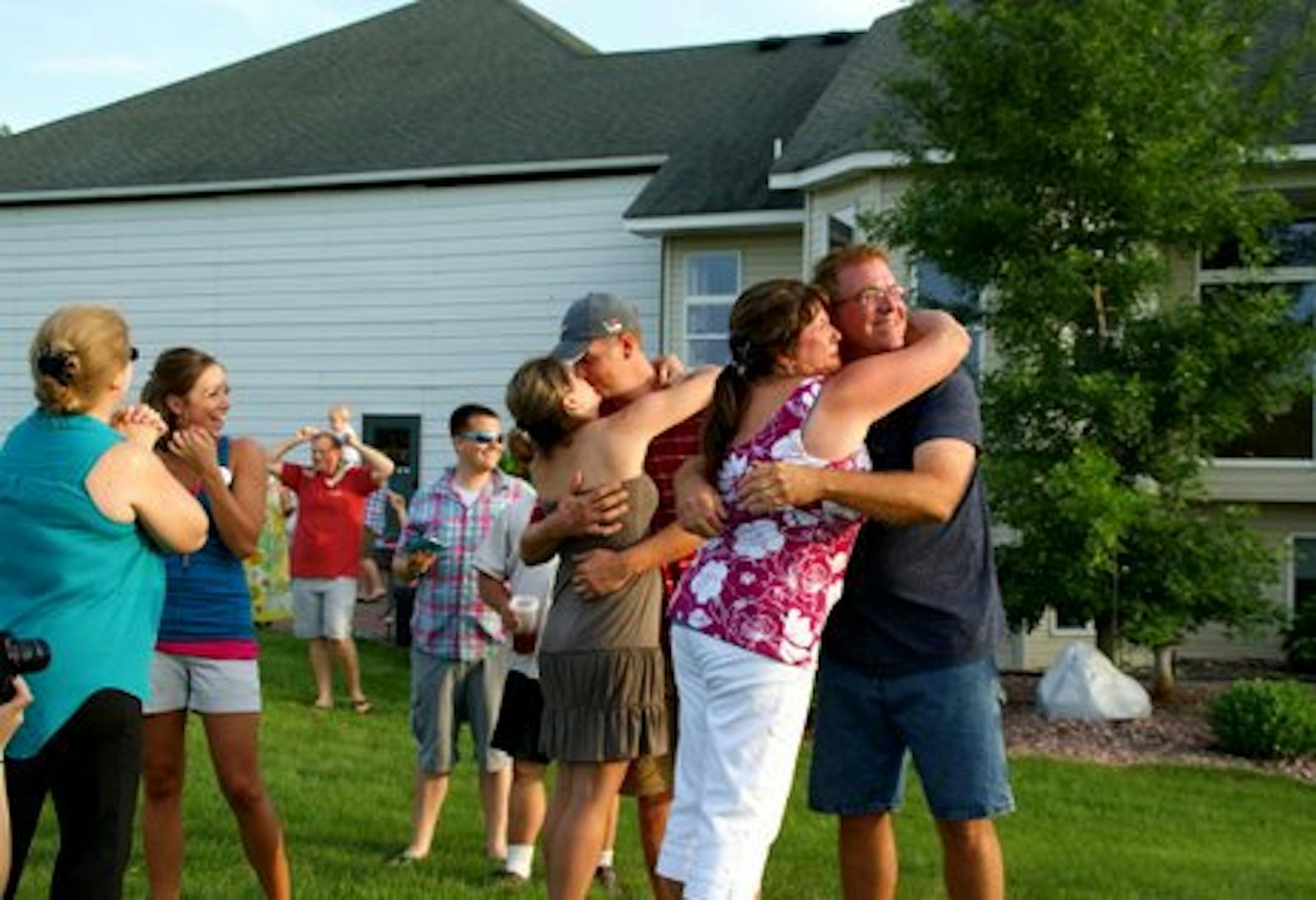 Courtesy Jerry Goodrich Abbyís parents, Sandy and Mark Spanier, and Abby and Nate Altman celebrate the news with embraces that say nothing brings more joy than a baby.