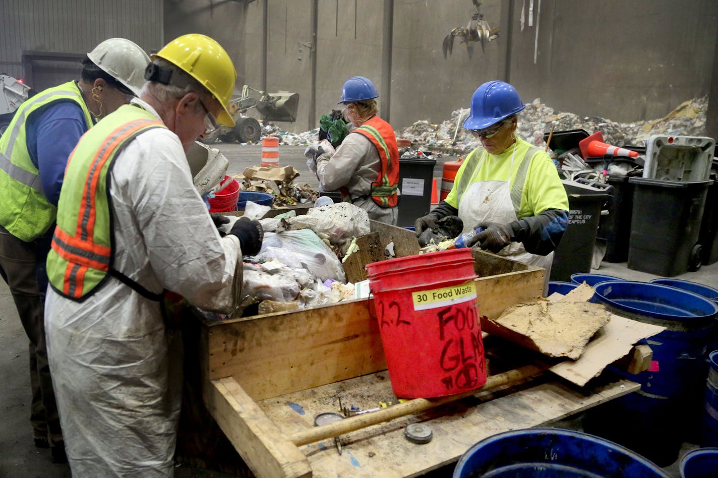 As waste sorters, who are contracted by the county, sift through trash to check the contents during a week-long study at the Hennepin Energy Recovery Center (HERC) May, 12, 2016, in Minneapolis, MN.](DAVID JOLES/STARTRIBUNE)djoles@startribune Hennepin County is digging into residents garbage to learn more about what they are throwing away and what opportunities we are missing to recycle more. The study involves sorting trash into new categories that will provide better, more specific information