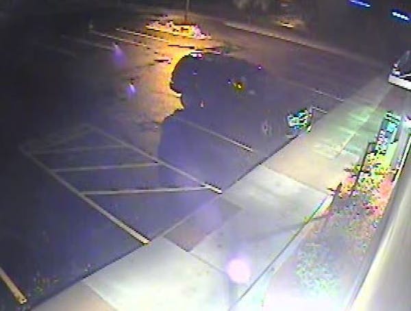 Video surveillance from Wednesday's holdup of Burger King in Maple Grove shows the suspect's vehicle, a Dodge Durango.