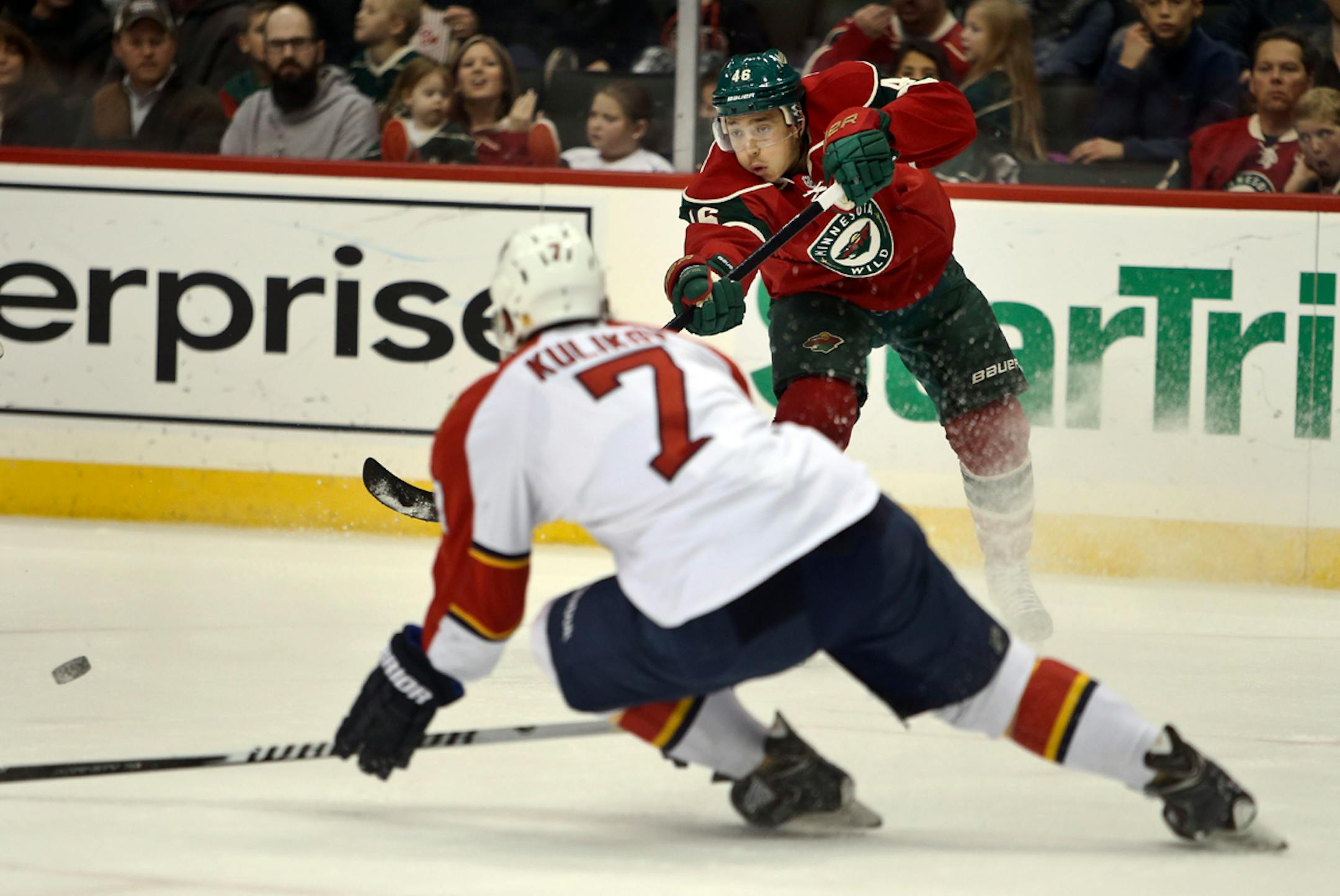 During the first period, Florida's Dmitry Kulikov (7) tries to defend a centering shot by the Minnesota Wild's Jared Spurgeon (46) at the Xcel Energy Center Friday, Nov. 15, 2013, in St. Paul.
