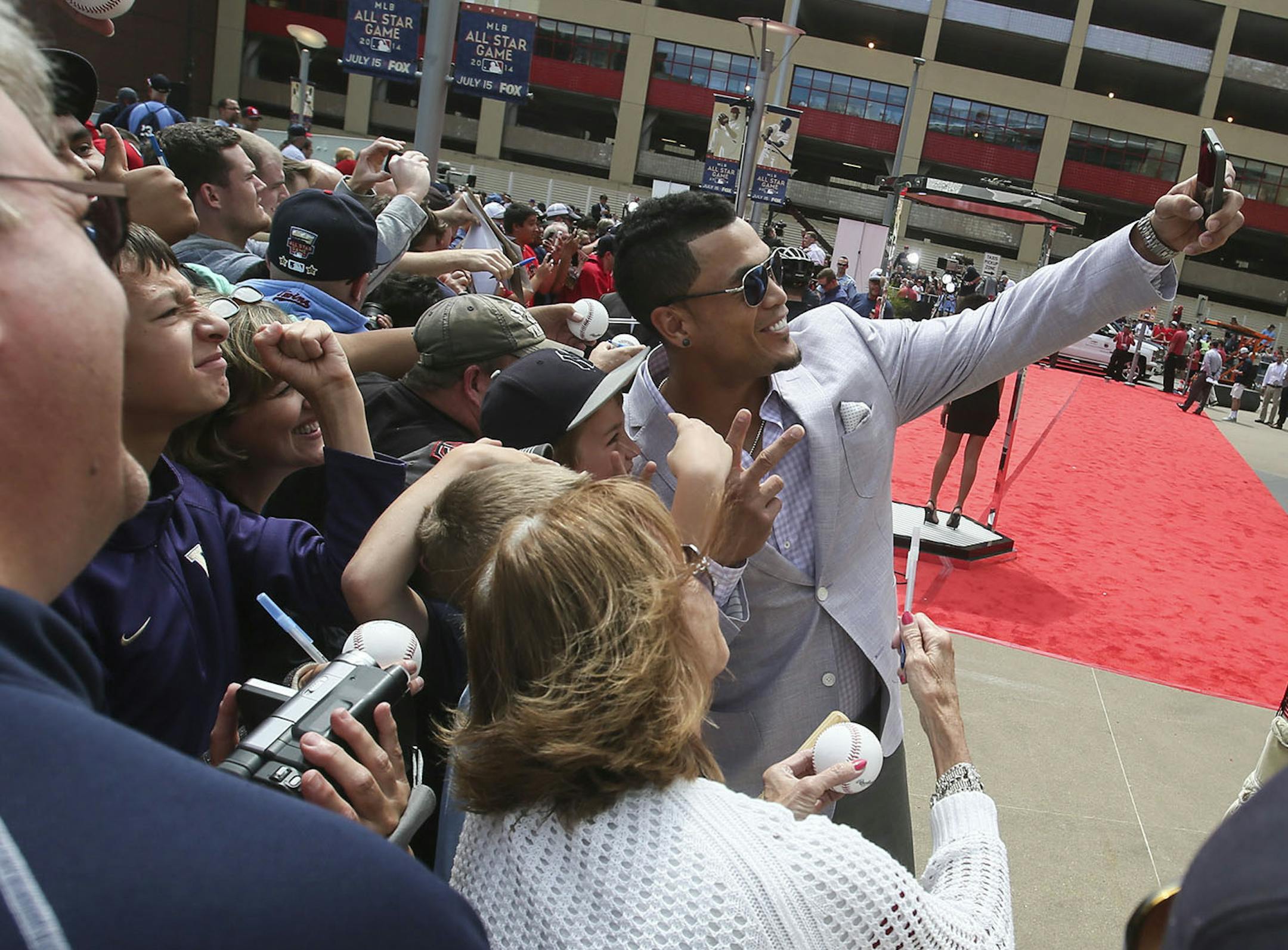 2014 All-Star Giancarlo Stanton of Miami takes a selfie with fans during the 2014 All-Star Red Carpet Show Tuesday, July 15, 2015, at Target Field in Minneapolis, MN.] (DAVID JOLES/STARTRIBUNE) djoles@startribune 2014 All-Star Red Carpet Show Tuesday, July 15, 2015, at Target Field in Minneapolis, MN.