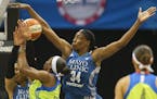 Minnesota Lynx center Sylvia Fowles (34) gets a piece of the ball as Dallas Wings forward Karima Christmas (13) drives to the basket. ] Timothy Nwachu
