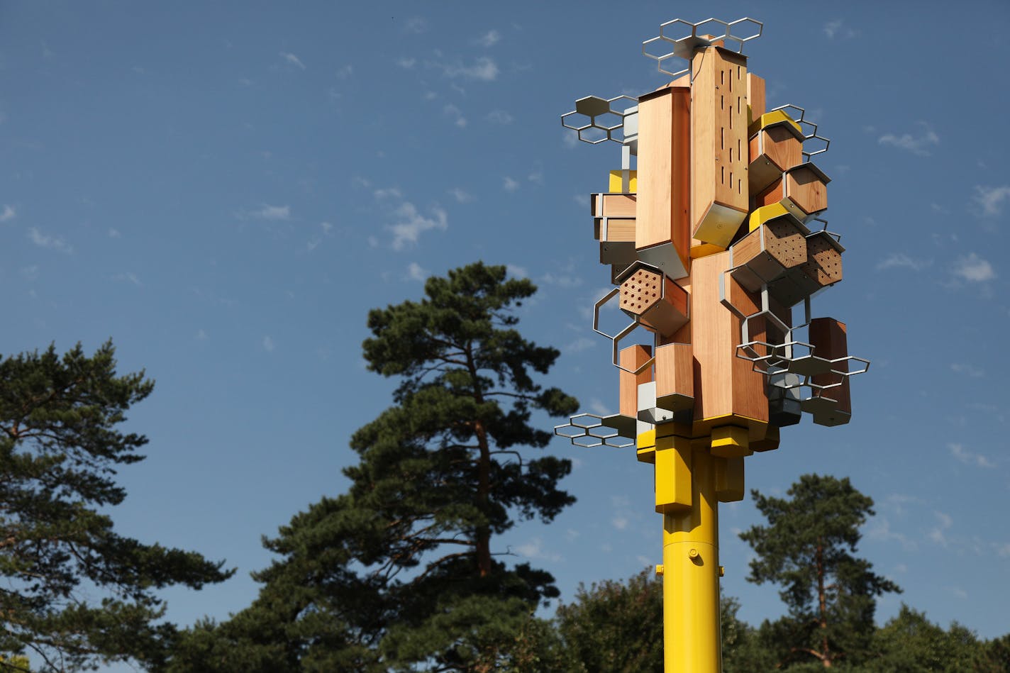 The city of St. Paul's first bee "Sky-Rise" habitat sat atop a pole Wednesday morning near Como Park. ] ANTHONY SOUFFLE &#xef; anthony.souffle@startribune.com Public Art St. Paul held a event to unveil the city's first bee "Sky-Rise" habitat Wednesday, Sept. 13, 2017 near Como Park in St. Paul, Minn. The high rise home for pollinators was designed to not only provide bee habitat, but to allow researchers to study how wild bees use man-made structures.