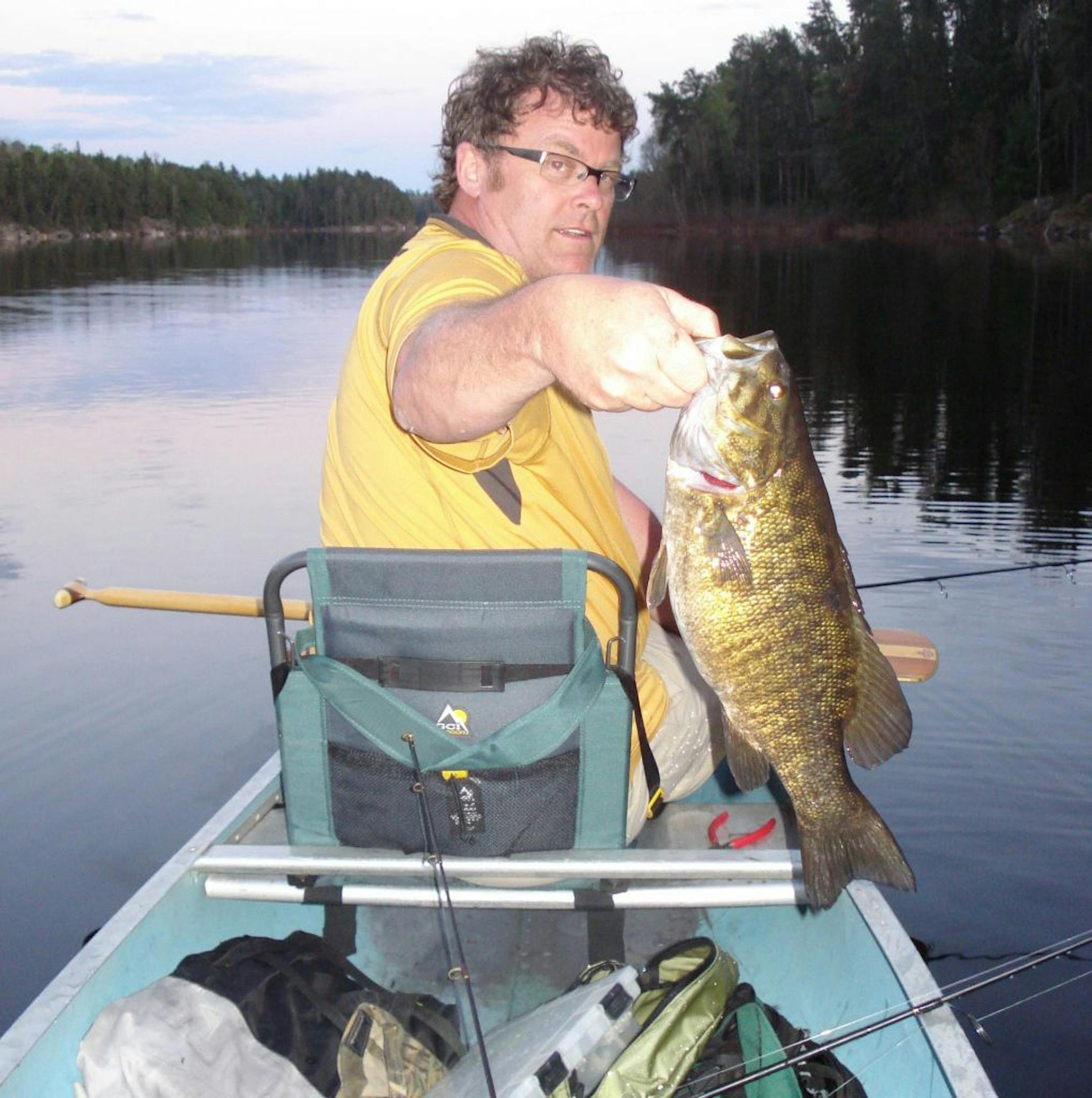 John Walker of Shakopee landed this 19½-inch smallmouth bass while fishing with his buddies on a yearly trip to Lac La Croix in the Boundary Waters Canoe Area Wilderness.
