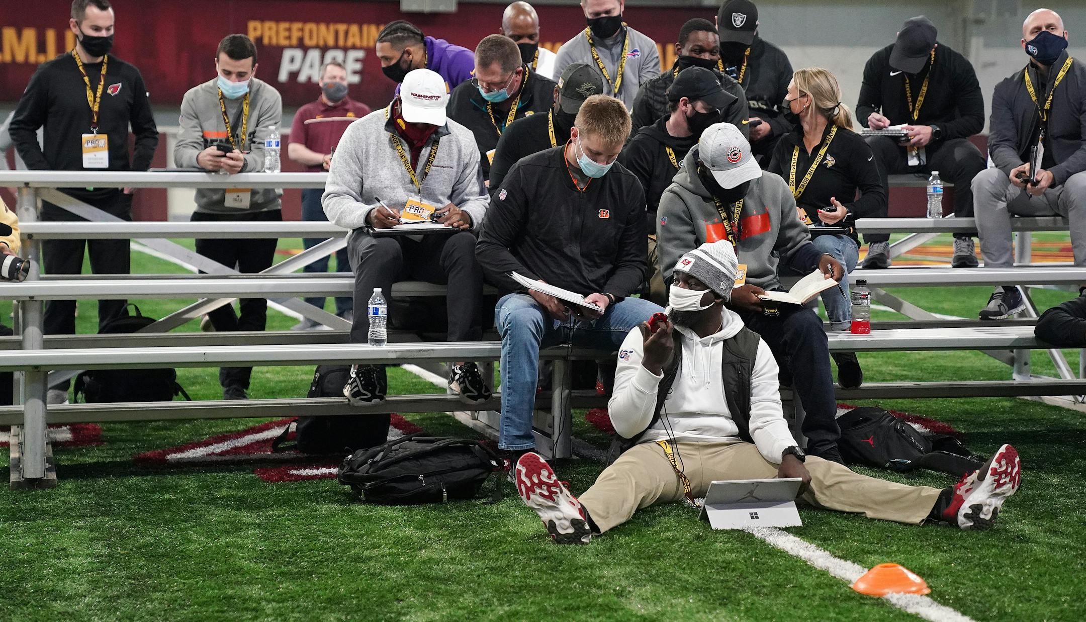 NFL scouts conferred with each other as they watched University of Minnesota football players wide receiver Rashod Bateman and cornerback Benjamin St-Juste run sprints during Pro Day.