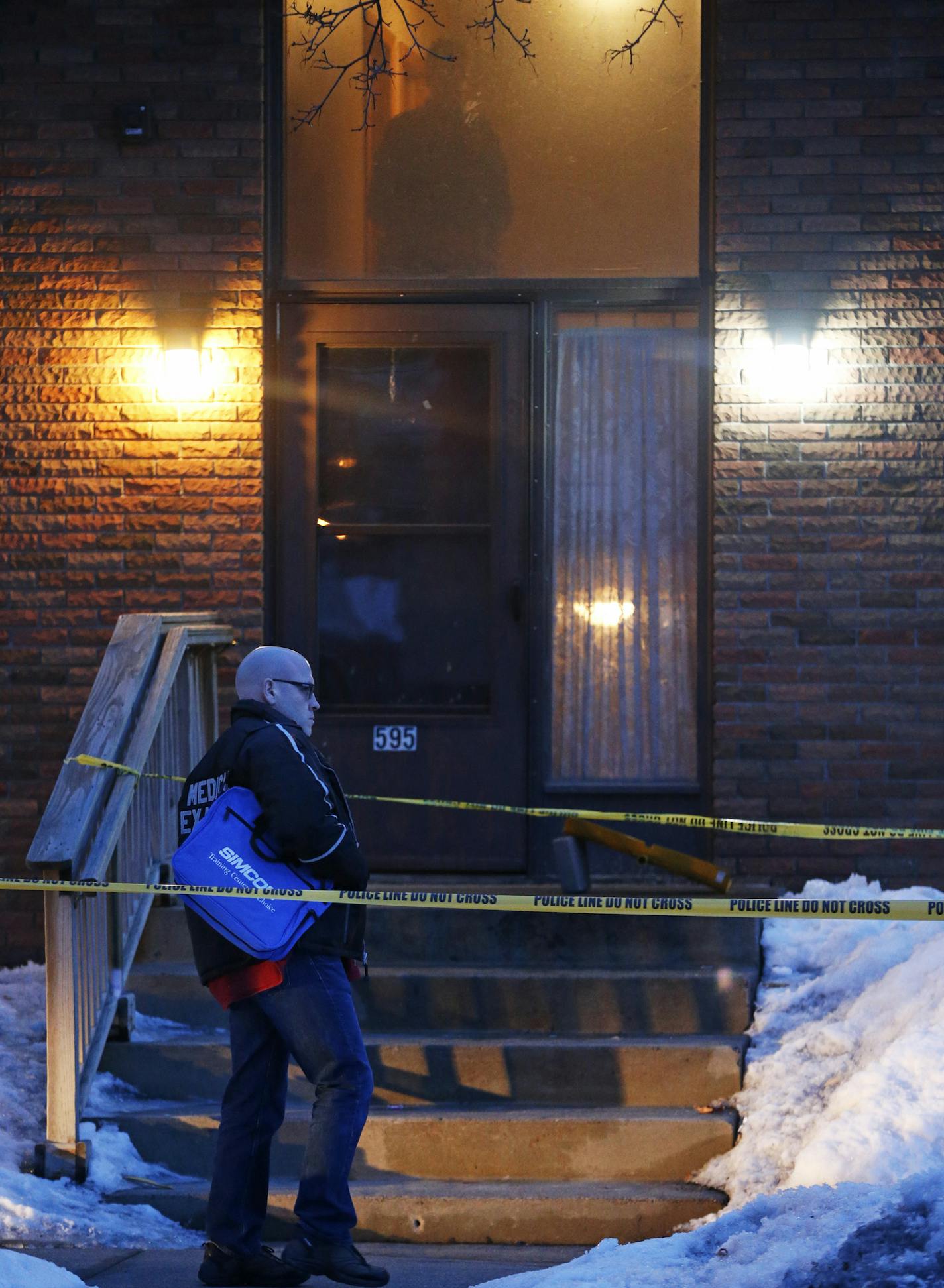 In the Frogtown neighborhood of St. Paul, police including the medical examiner investigated the scene of a triple homicide at an apartment on Victoria Ave.]rtsong-taatarii@startribune.com